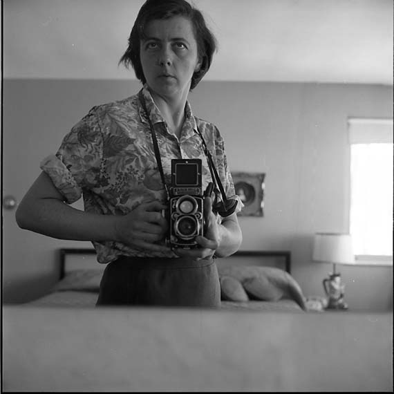 vivian_maier_highland_park_il_self_portrait_bedroom_mirror_1965.jpg