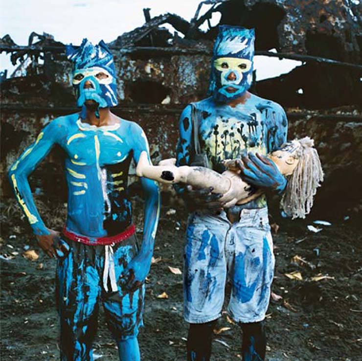 Two Men Carrying Sick Baby to the Hospital Jacmel Haiti 2004.jpg