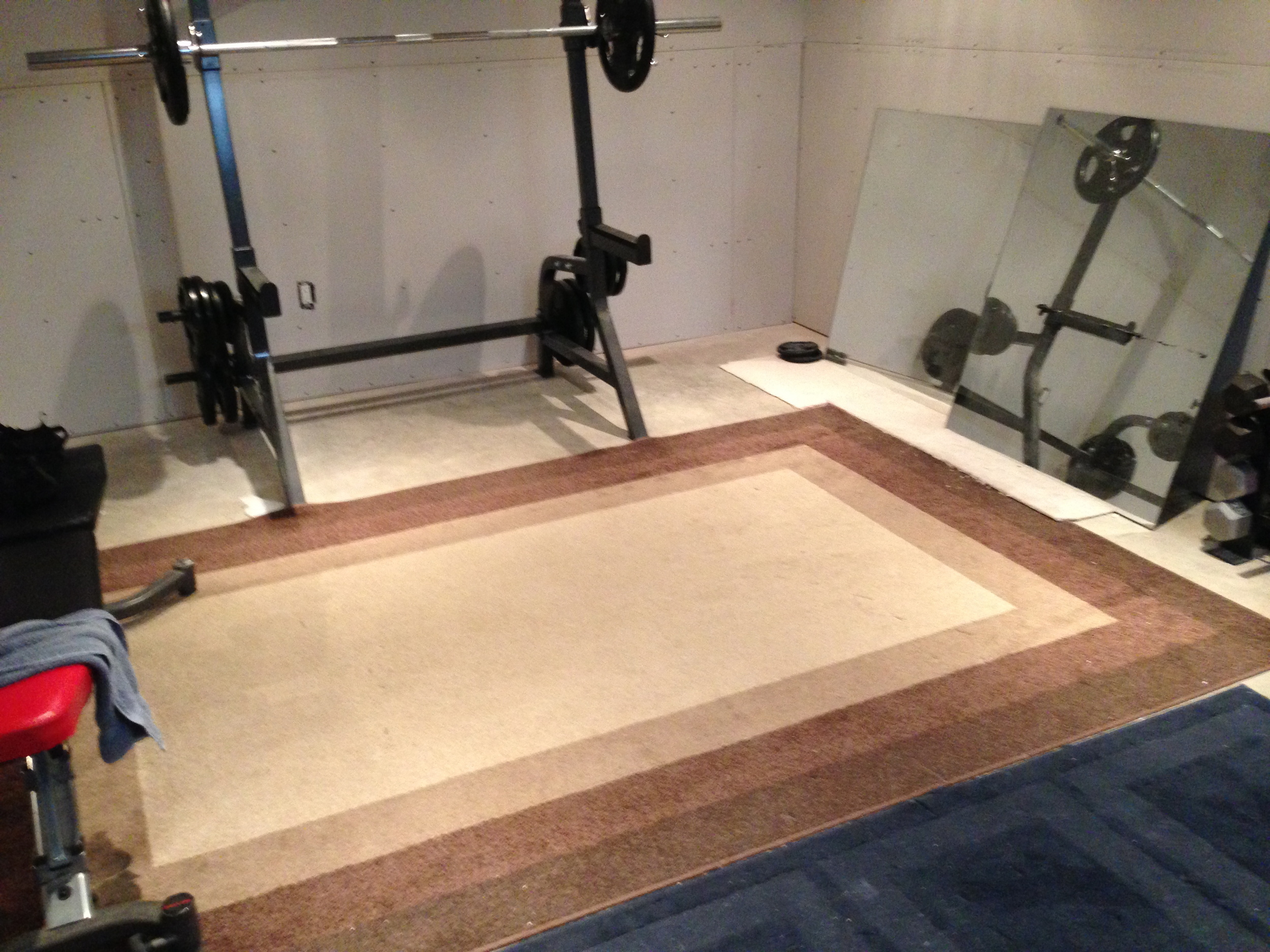 After the drywalling was completed, it was time to get rid of the carpet flooring which provided absolutely zero cushioning.