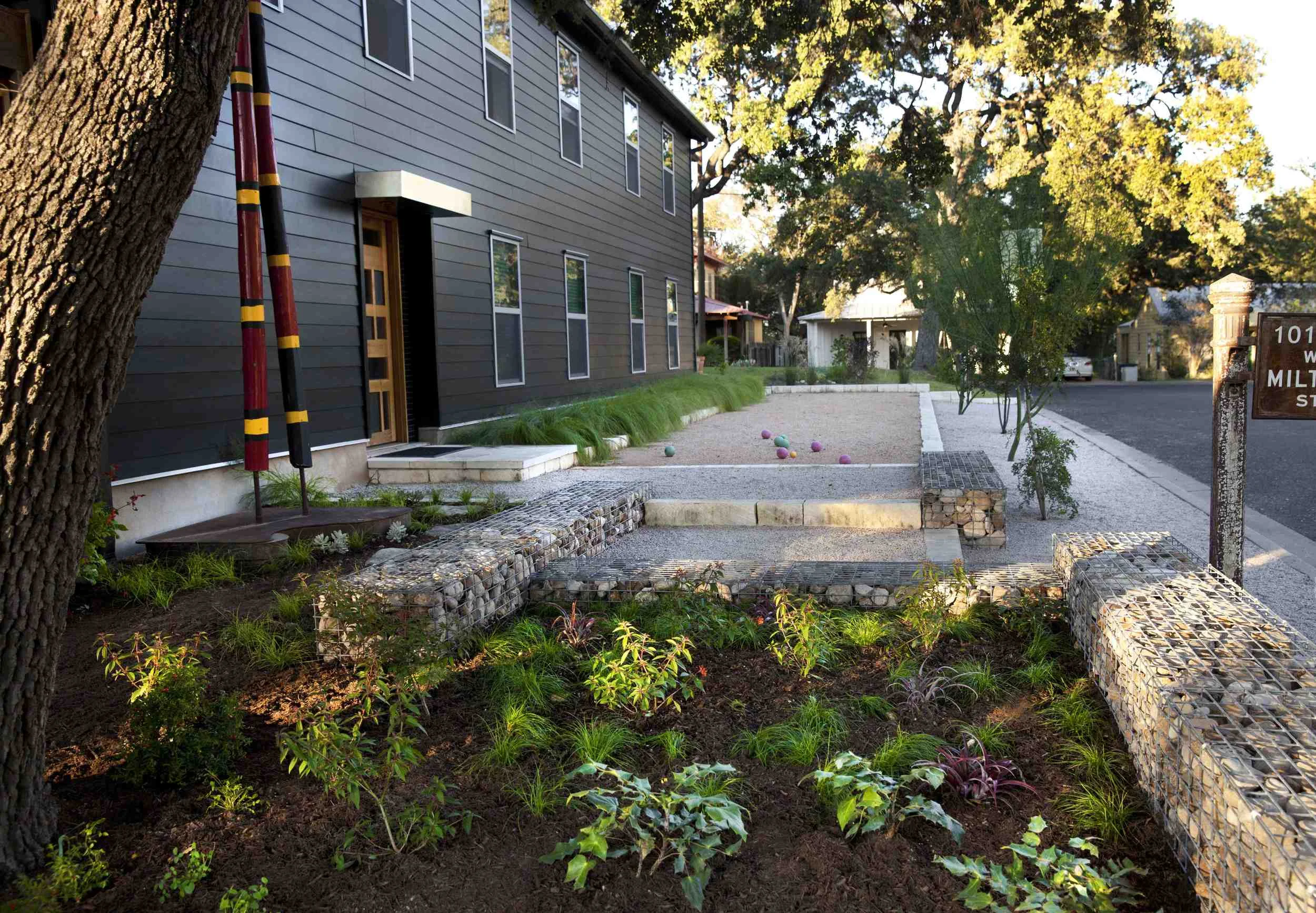 mulched plantings at a bocce ball court