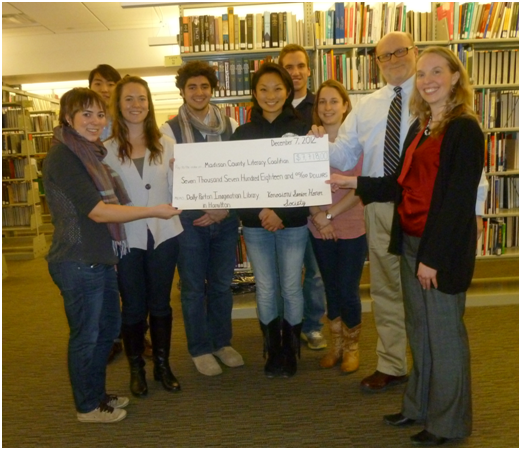 On Thursday, Feb. 7, Konosioni presented Jay Dunn (MCLC Executive Director) and Hilary Vigil (Hamilton Public Library Director) their check to the Madison County Literacy Coalition.
