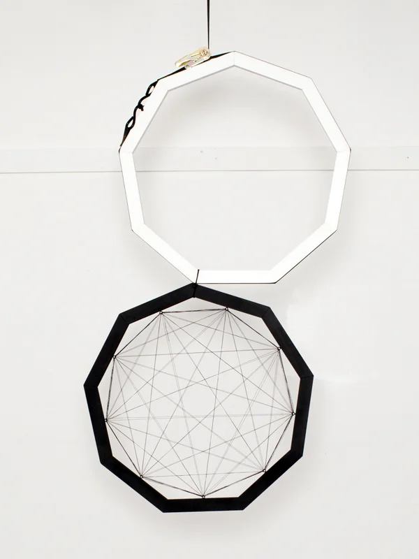 Present tense Wood, spray paint, wire, nylon clamp and paracord Two 27" diameter nonagons