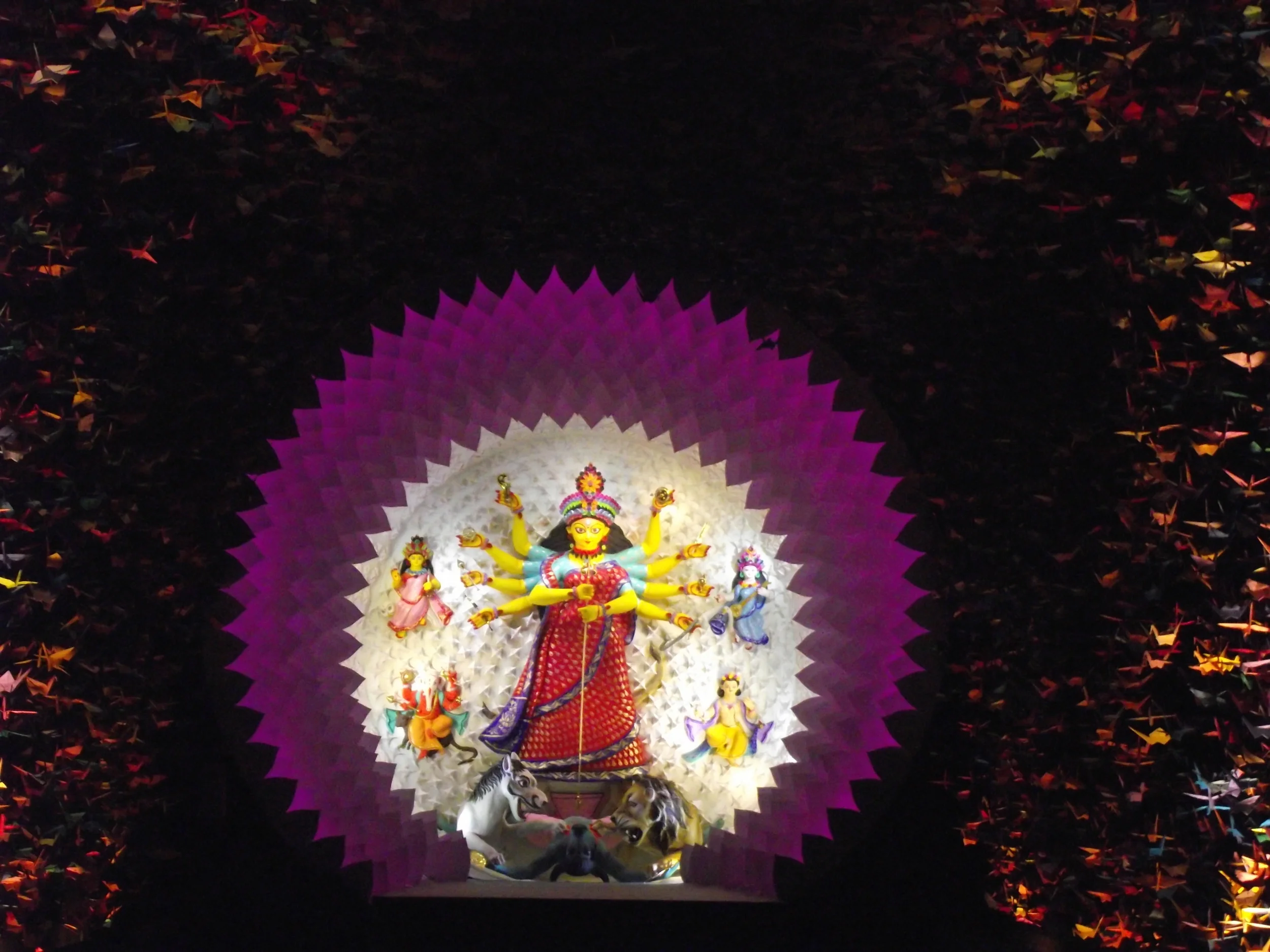  The  chaalchitra  of Durga was multiple layers of origami in white and pink. It was creating a fantastic halo effect. 