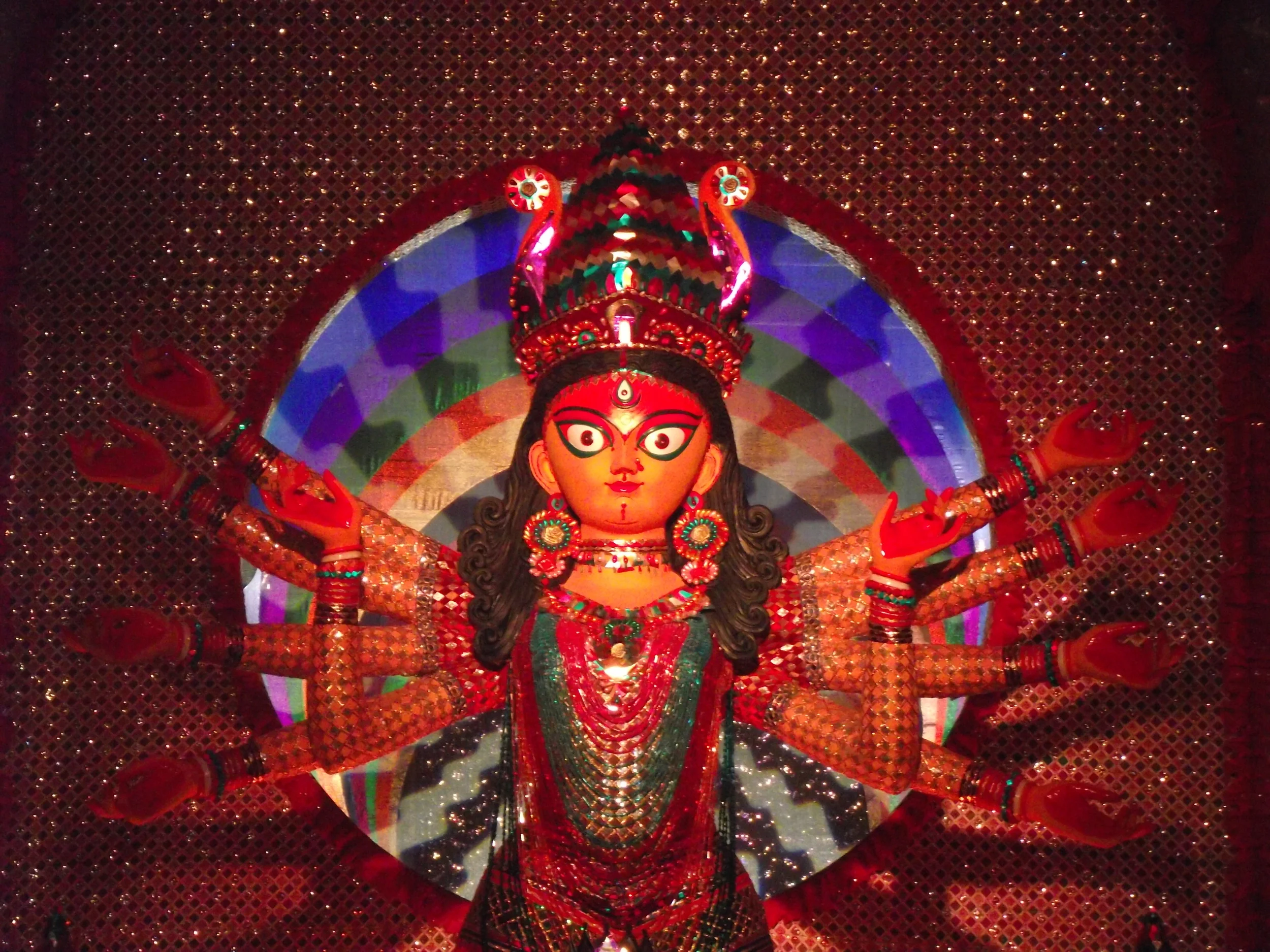  The pandal had some revolving wheels in motion (in sync with music) which created an effect of dancing shadows in the walls of the pandal. Here is some dancing shadows in the backdrop of Durga. 
