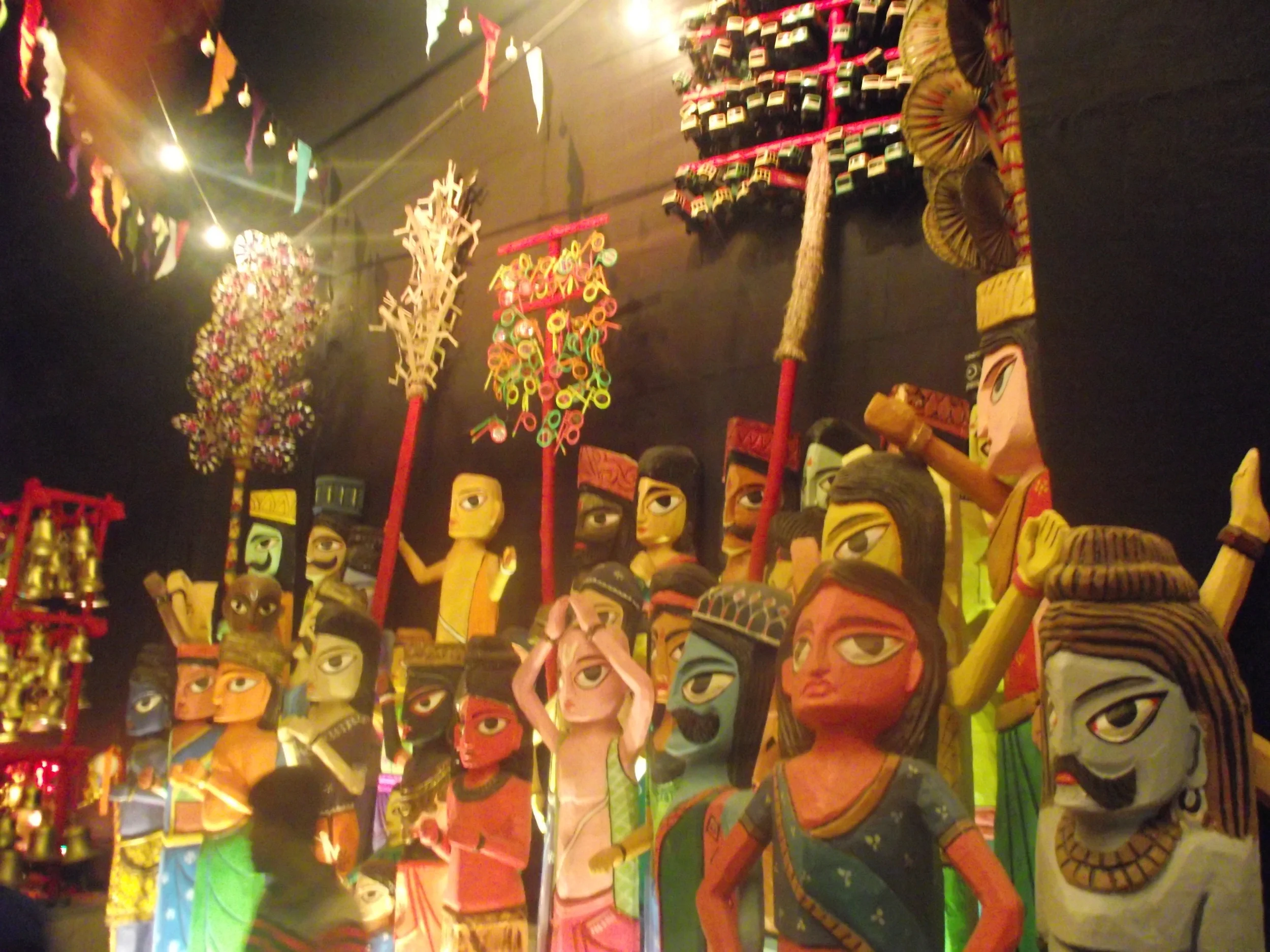  The kids have gathered to enjoy the  mela  around the temple. They are buying toys from the vendors around... 