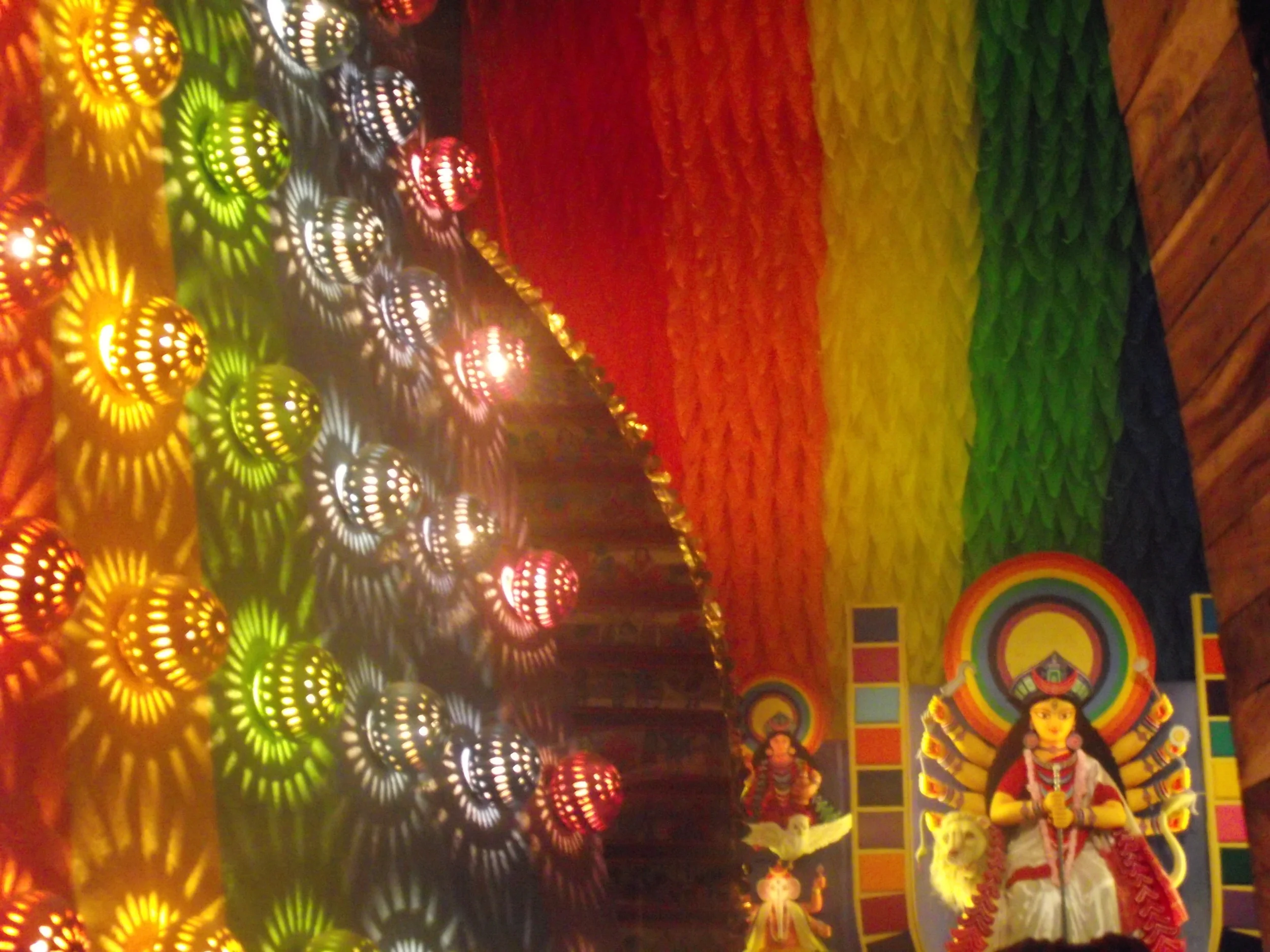  Heavenly effect. Durga at a distance and moving fretworked lamp shades on each colour bands made the atmosphere magical. 