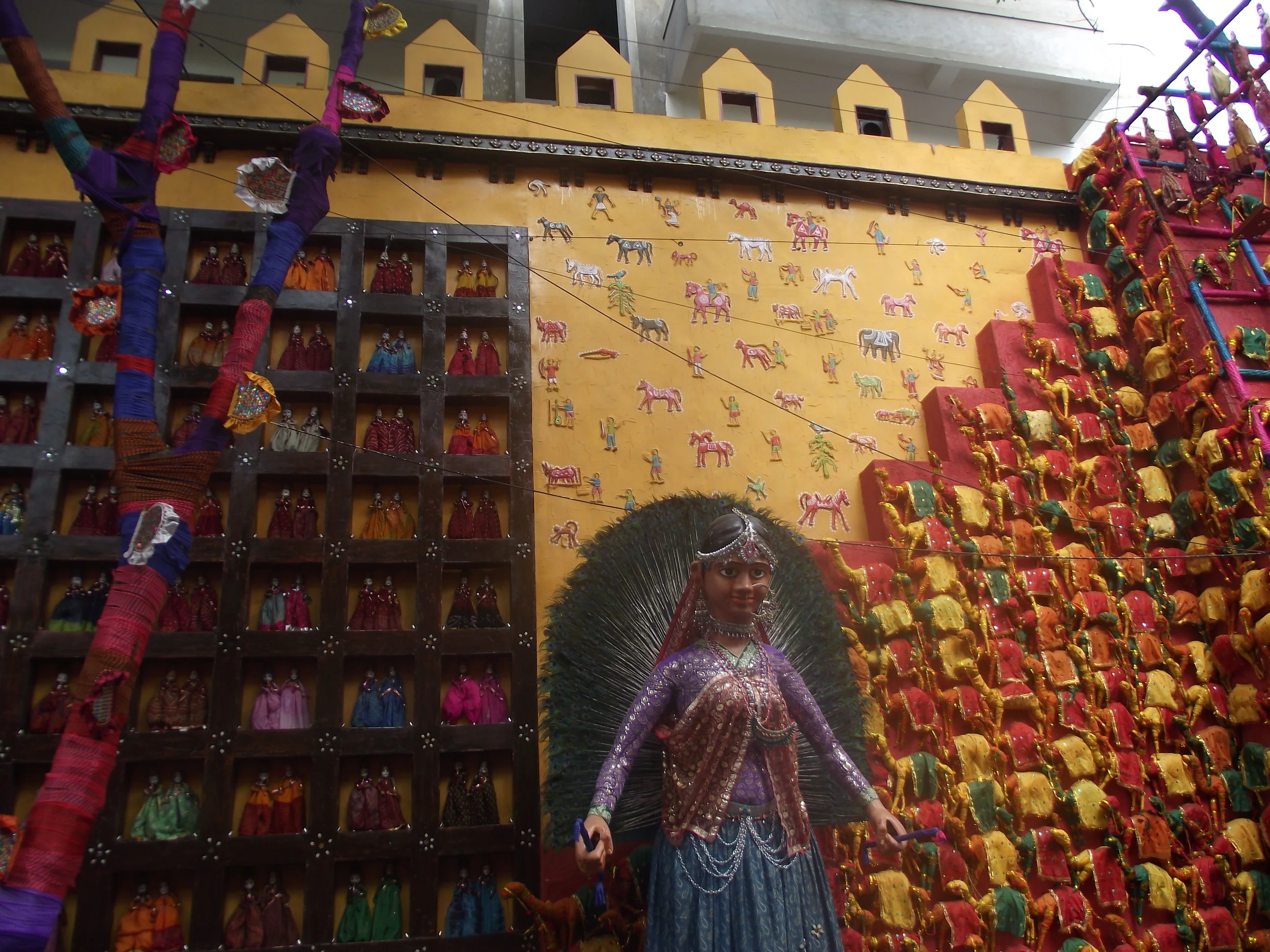  Rural paintings and crafts used along the walls as one enters the main premises. 