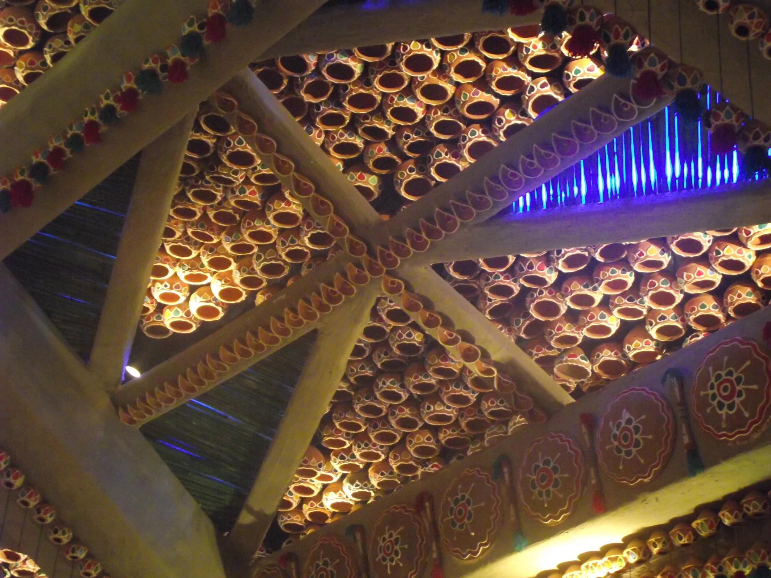  Look at the symmetric arrangement of clay pottery on the ceiling. Every single piece has paints of different colours elevating their beauty 