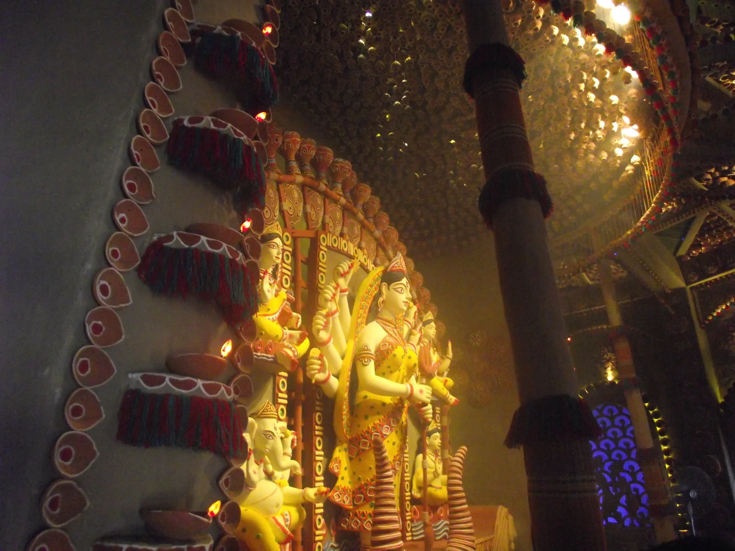  Glimpse of Durga from the side wall. There was a light effect from the semi circular portico (again detailed with terracotta pottery) 