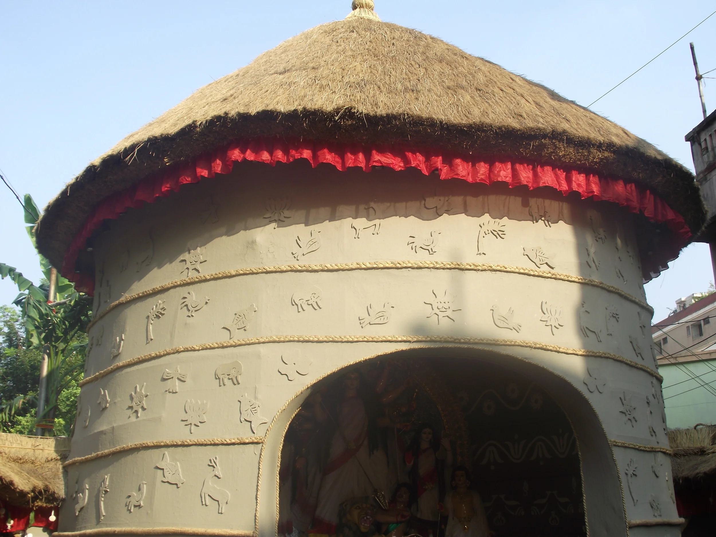  Its Nabanno festival, hence the place of worship has been created in a neat and tidy manner. The small carvings indicate happiness of everyone in the nature, human beings, trees and animals. And why not everyone be happy. Its time to harvest fresh c