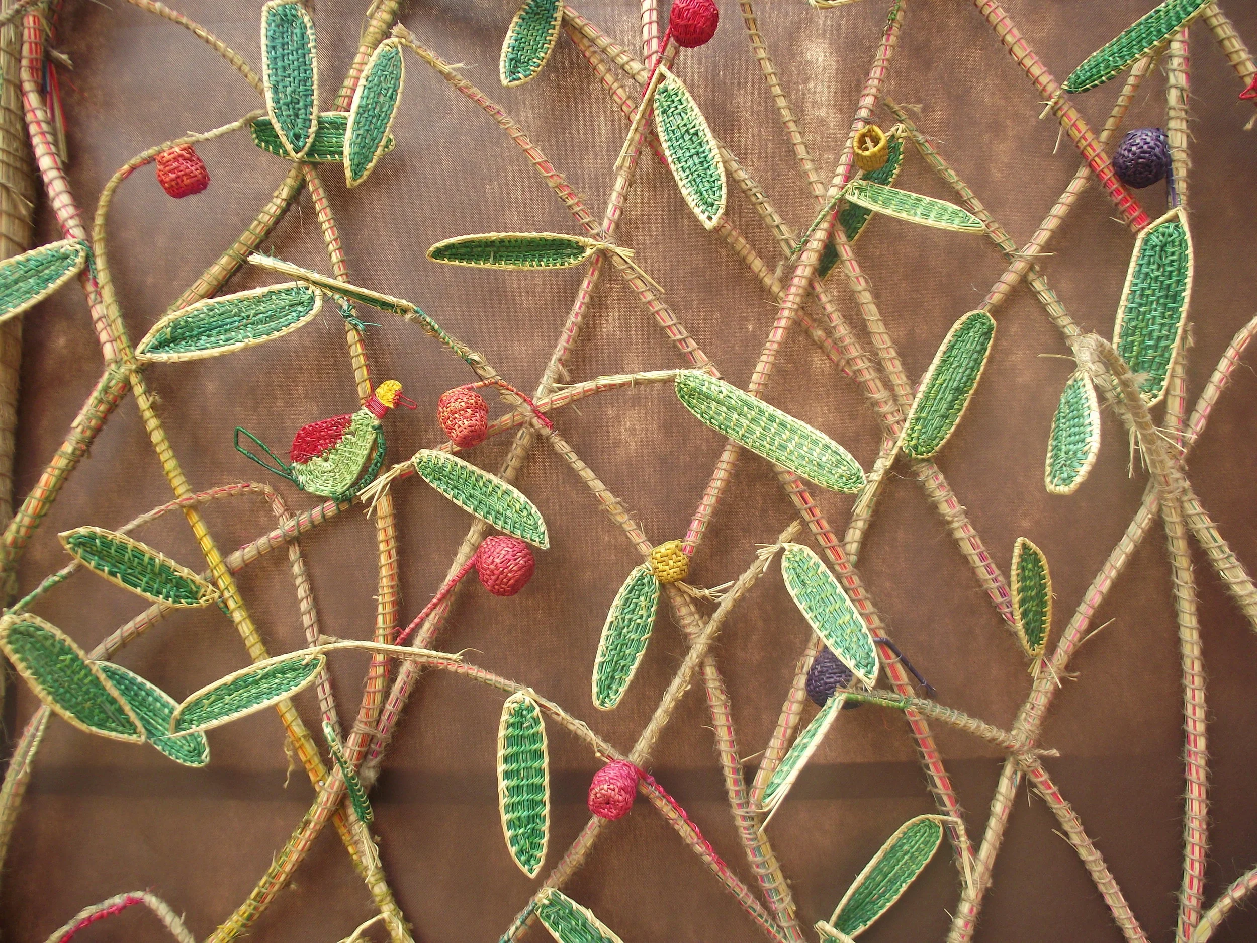  Beautiful depiction of tree and birds sitting on the stems. All made of meshed matts. 