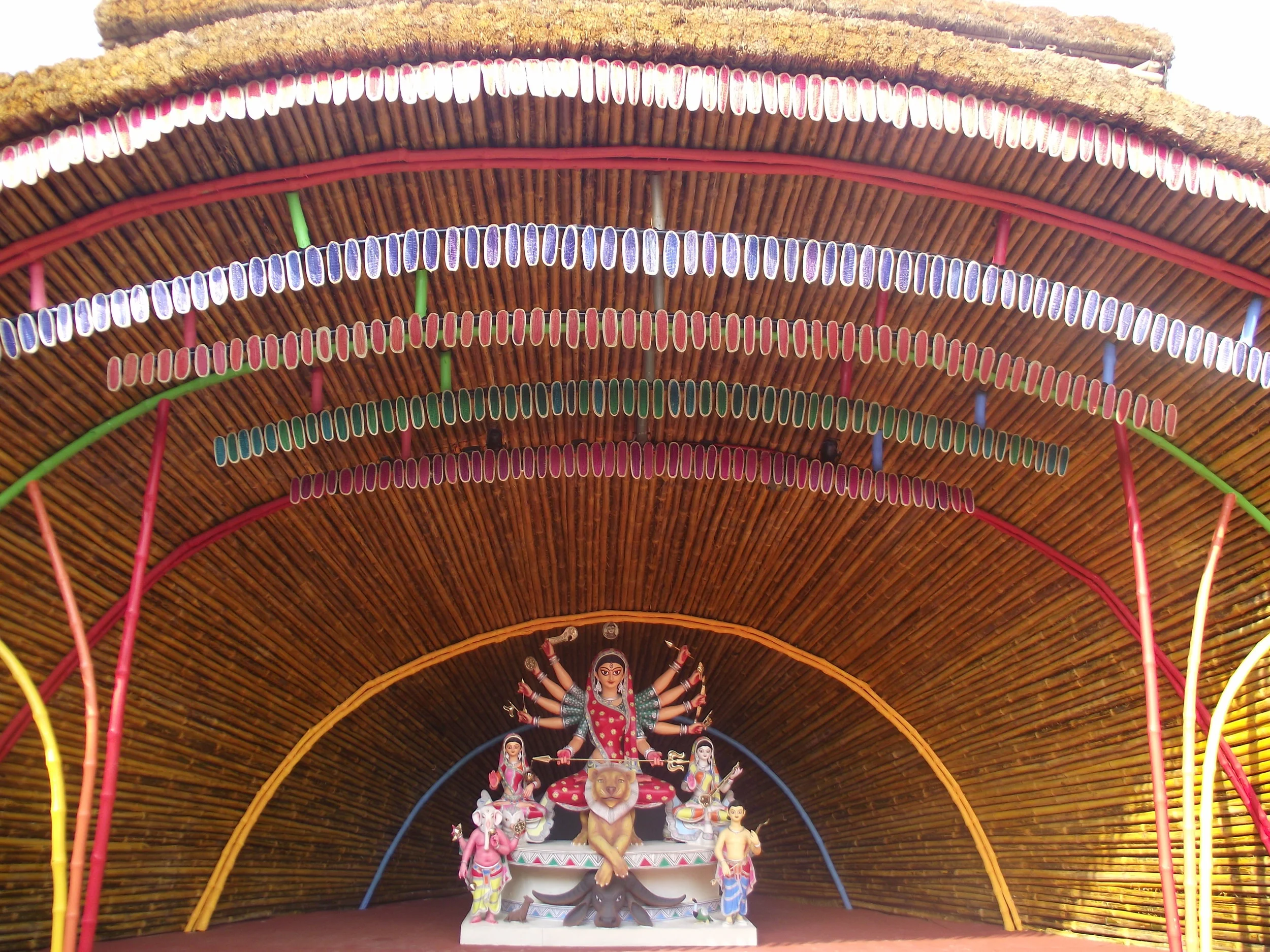  The central part of the pandal premises where Maa Durga resided. Again observe the clean presentation of hay and matt leaves. Surrounding Durga the arrangement of thin bamboo sticks had a feeling of an infinite hollow! 