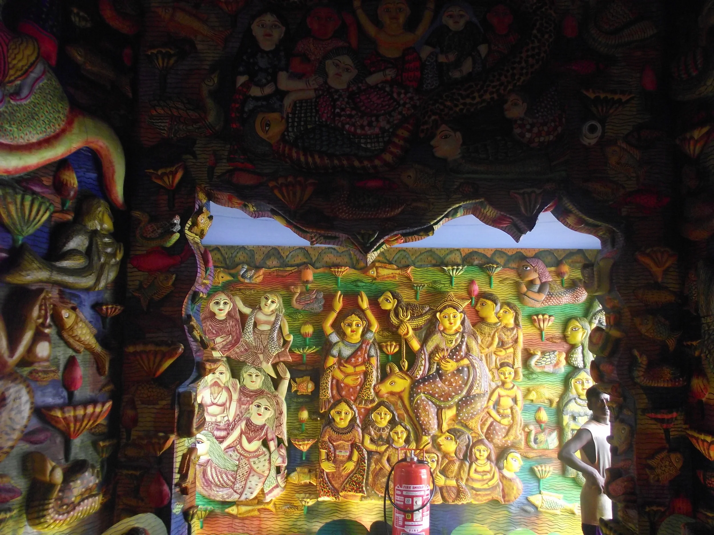  Wooden carvings have a similar finish. I am not sure if the entire pandal was prepared with so much of wood carvings! 