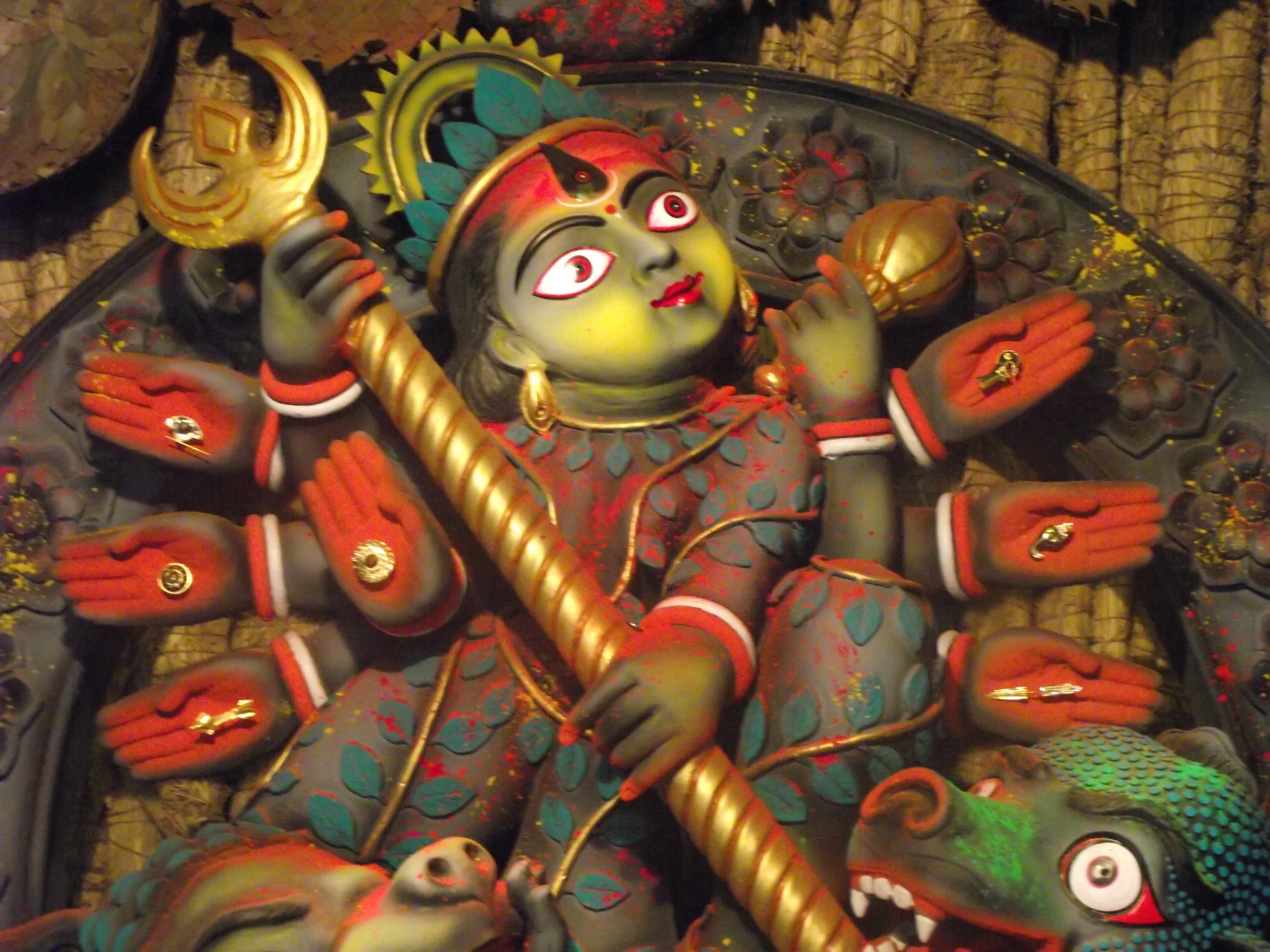  The leaves are symbolic to  Charak  plant. The idol was a big deviation from the Durga we are used to see. I am not a big fan such drastic imagination. I think it kinds of dilutes the overall central attraction of the festival which is Durga! 