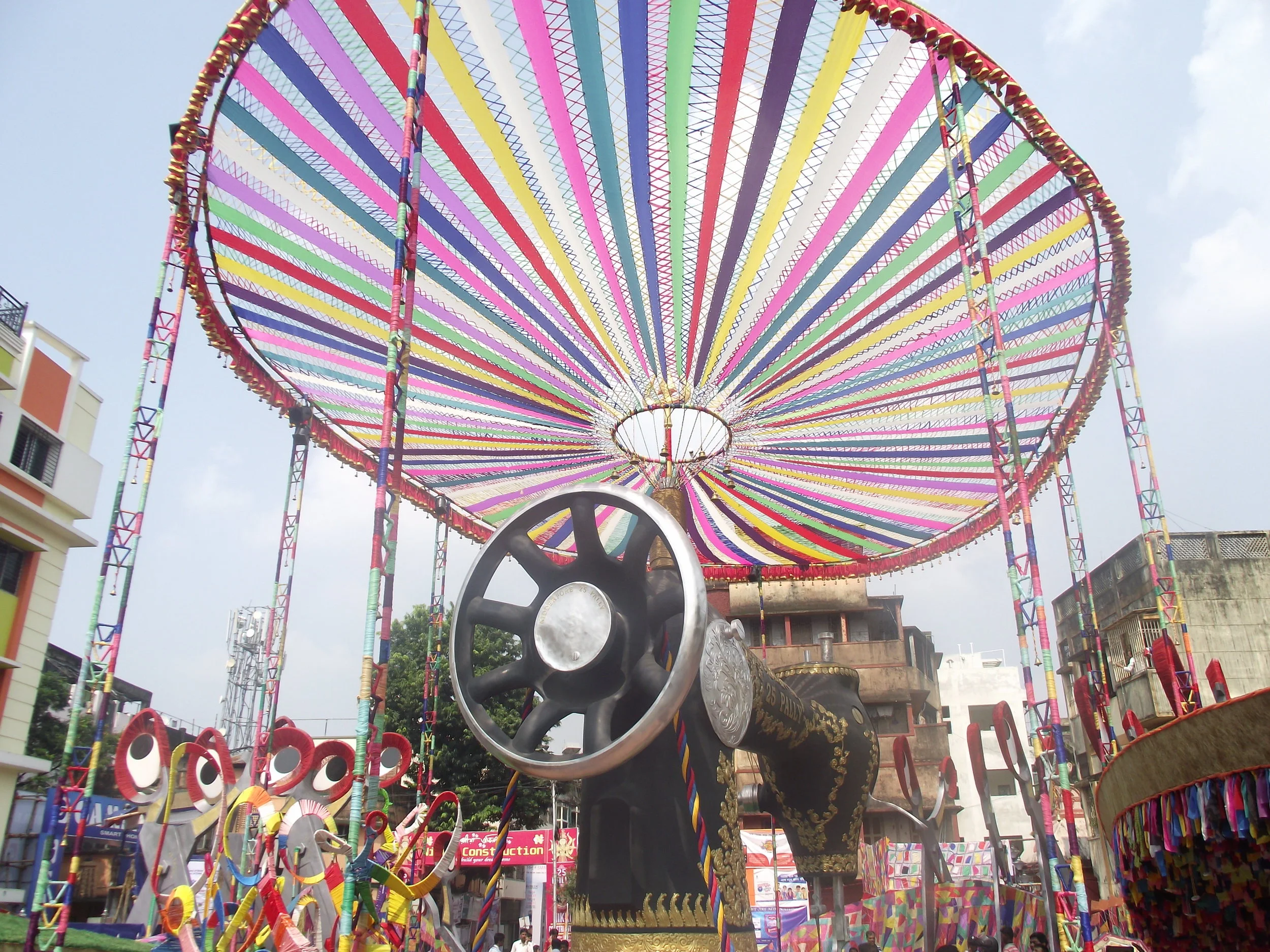  A big awning of colourful pieces of cloth indicating the harmony and diversity which Devi Durga wants to keep intact. Thats why she has stitched all these pieces together. 