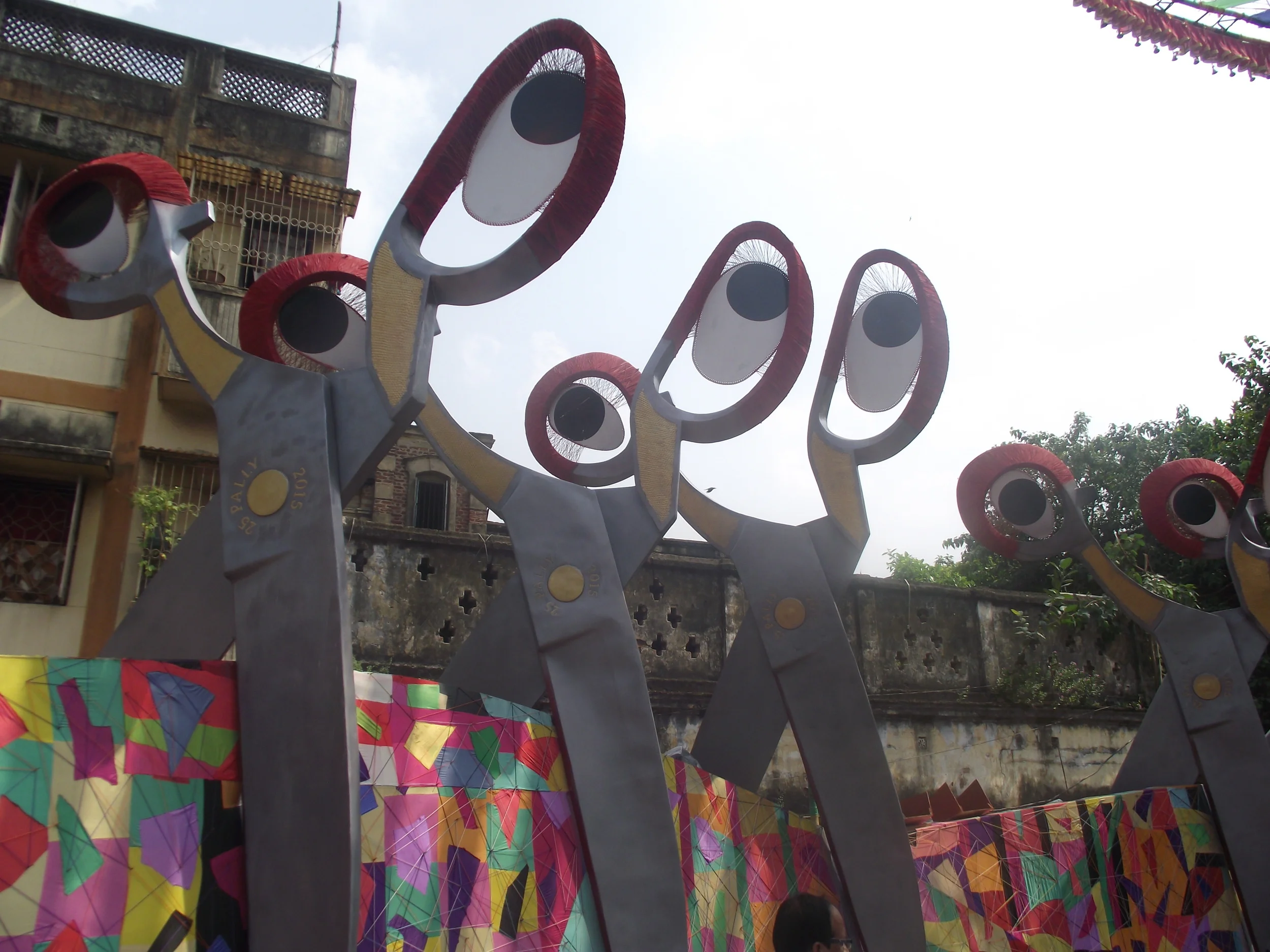  The scissors were used to symbolize the different splits and conflicts that mankind is creating in this society. 