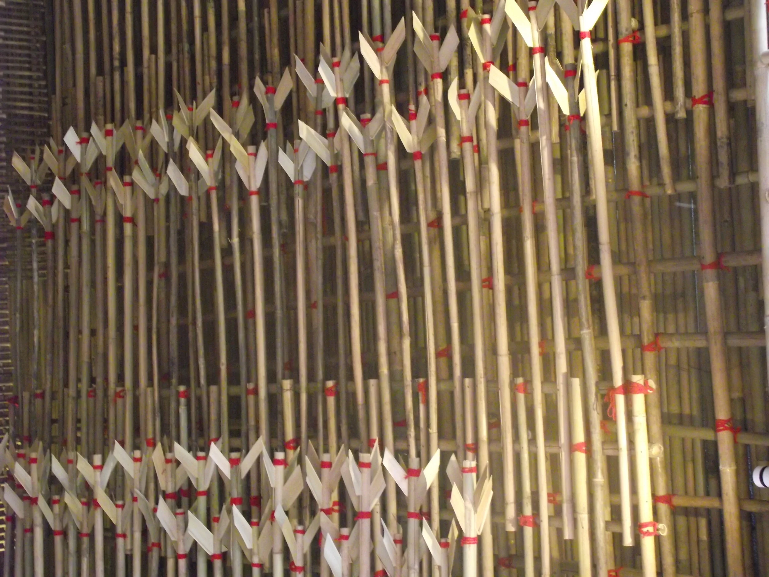  A close up view of the  tilkathis  (thin bamboo sticks) which were tied in a close mesh using red strings. 