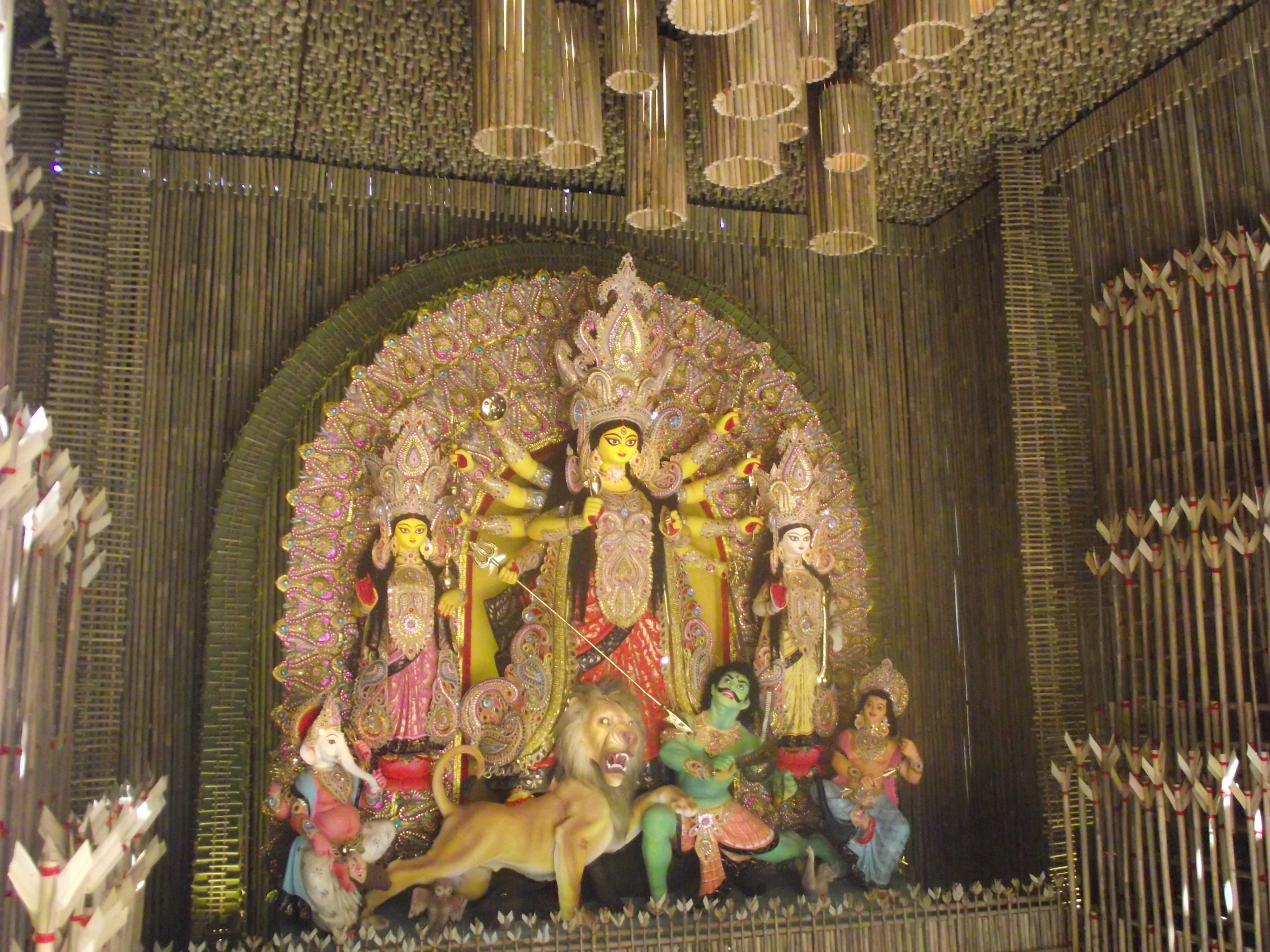 Adarsha Pally also makes a brilliant idol every. Its a ekchala pratima with a soothing and peaceful look. She makes the ambience peaceful. The main structure of the idol looks the every year. Its just the ornamentation and the  chaalchitra  which ch