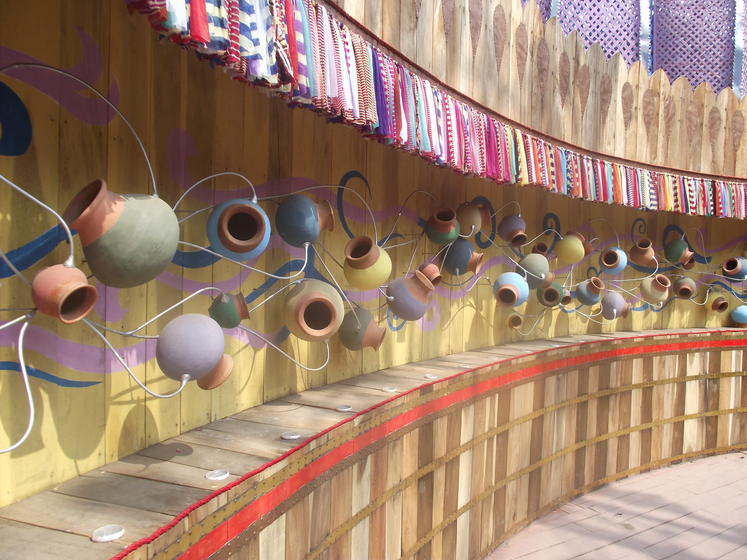  The pots and metal wires have been connected to symbolise the womb and the ever continuity of life. 