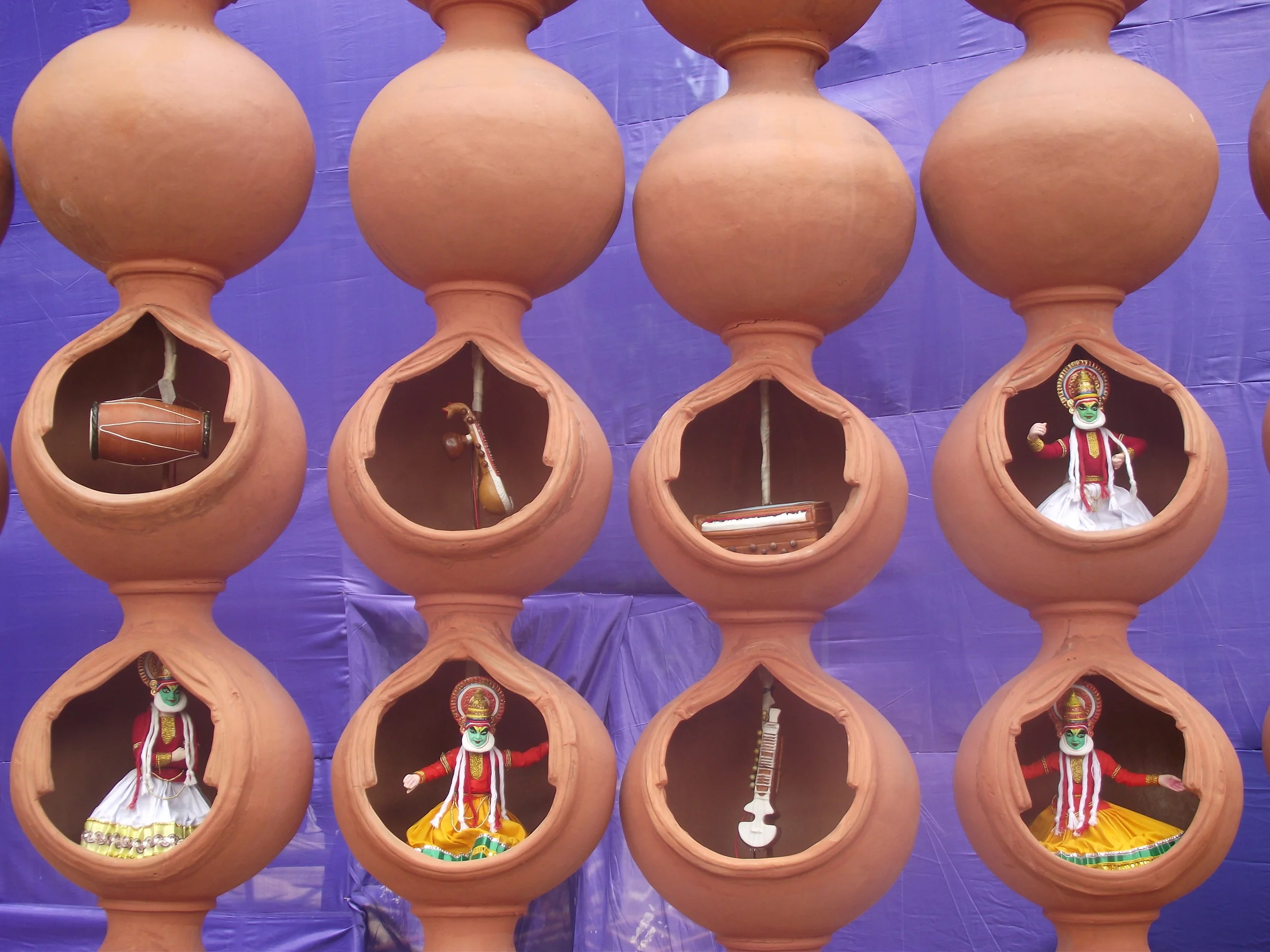  Dance and Music are interwoven forever. Great way to depict that connect through these interconnected terracotta pots which are curved in the form of a performing stage for music and dance. 