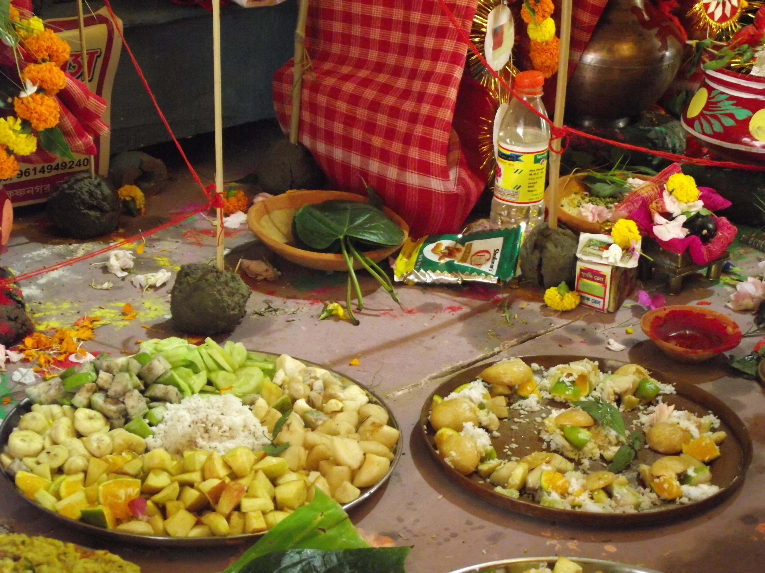  Neatly cut fruits arranges in bronze, brass and copper plates. After puja these fruits ( prasad ) will be distributed among the people in the pandal premises. In childhood days this distribution was a thrilling moment everyday after the puja. 