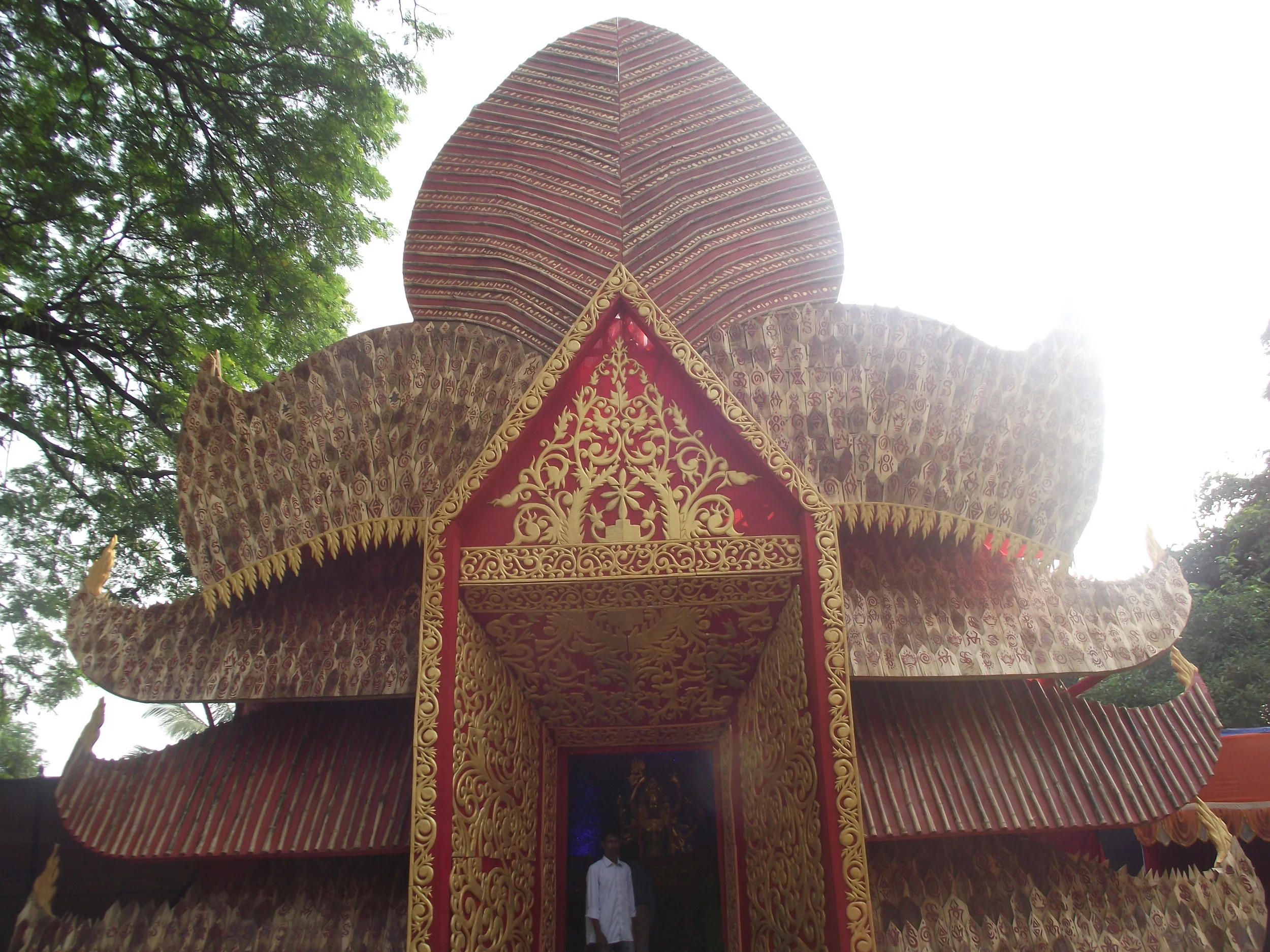 Innovative Stupa shaped pandal with lots of thin wood work... 