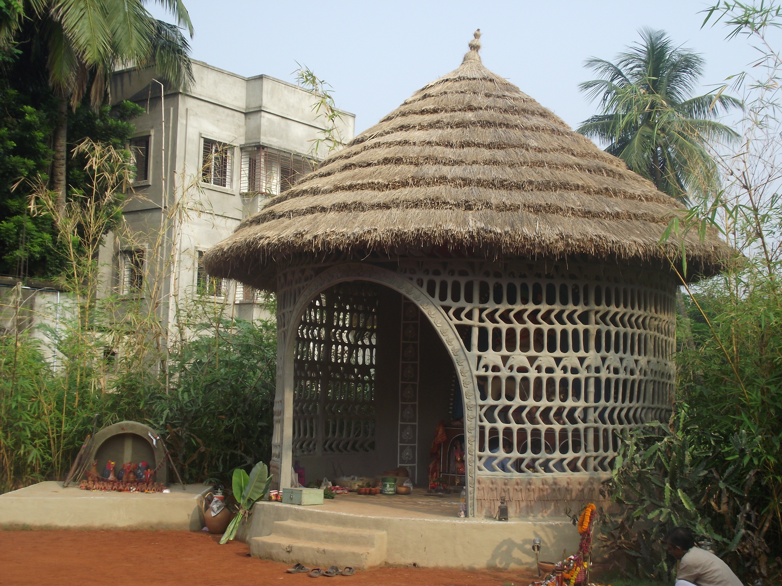  Place of worship for Maa Durga - a meshed wall with hay arranged in layers. 