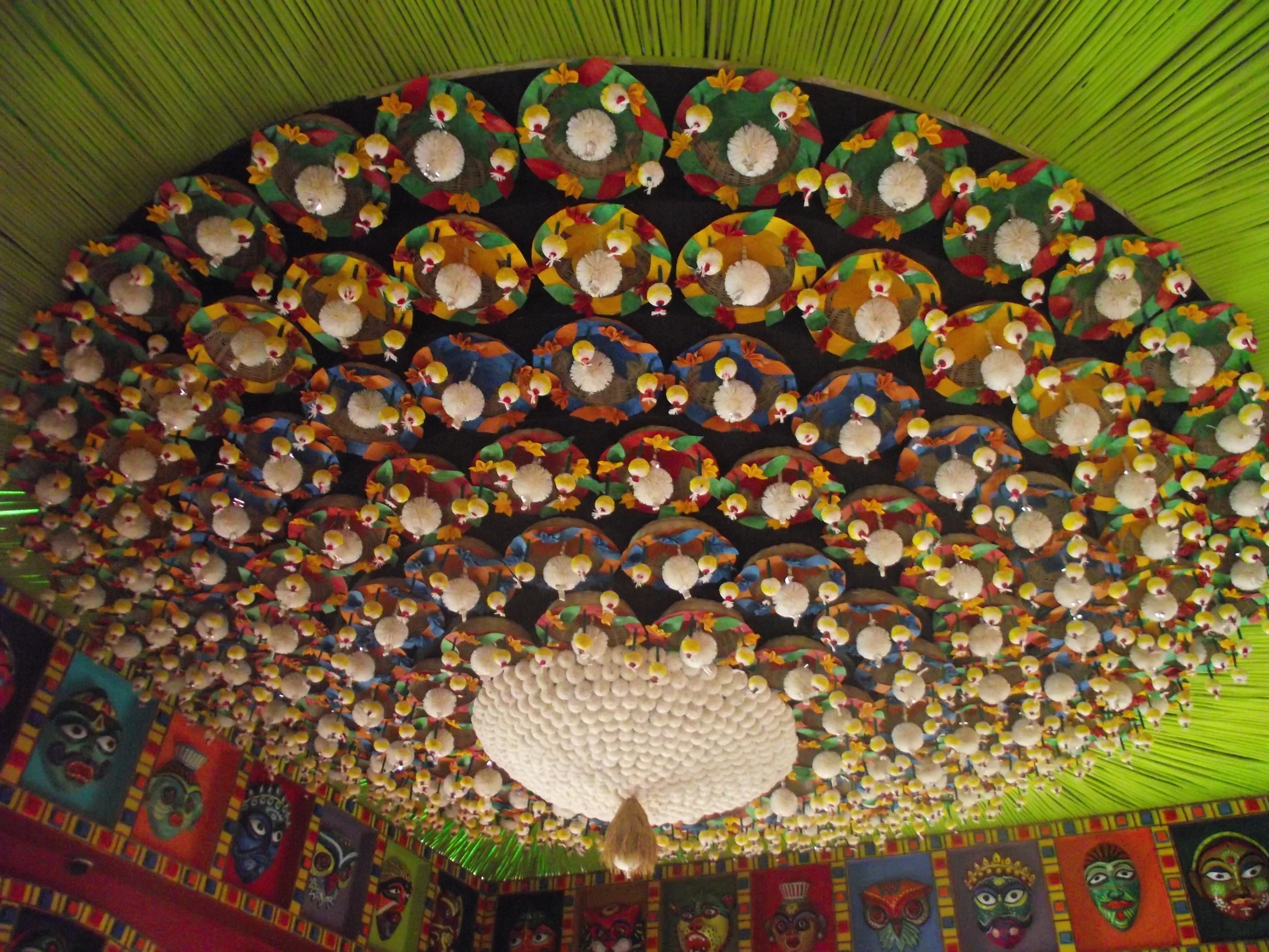 Ceiling with absolute brilliance.  Kadamful  (or Kadam flowers made from shola) were arranged in concentric circles and lots of colourful papers were used along with  kadam  flowers. The perimeter of the ceiling had colourful masks which has been an