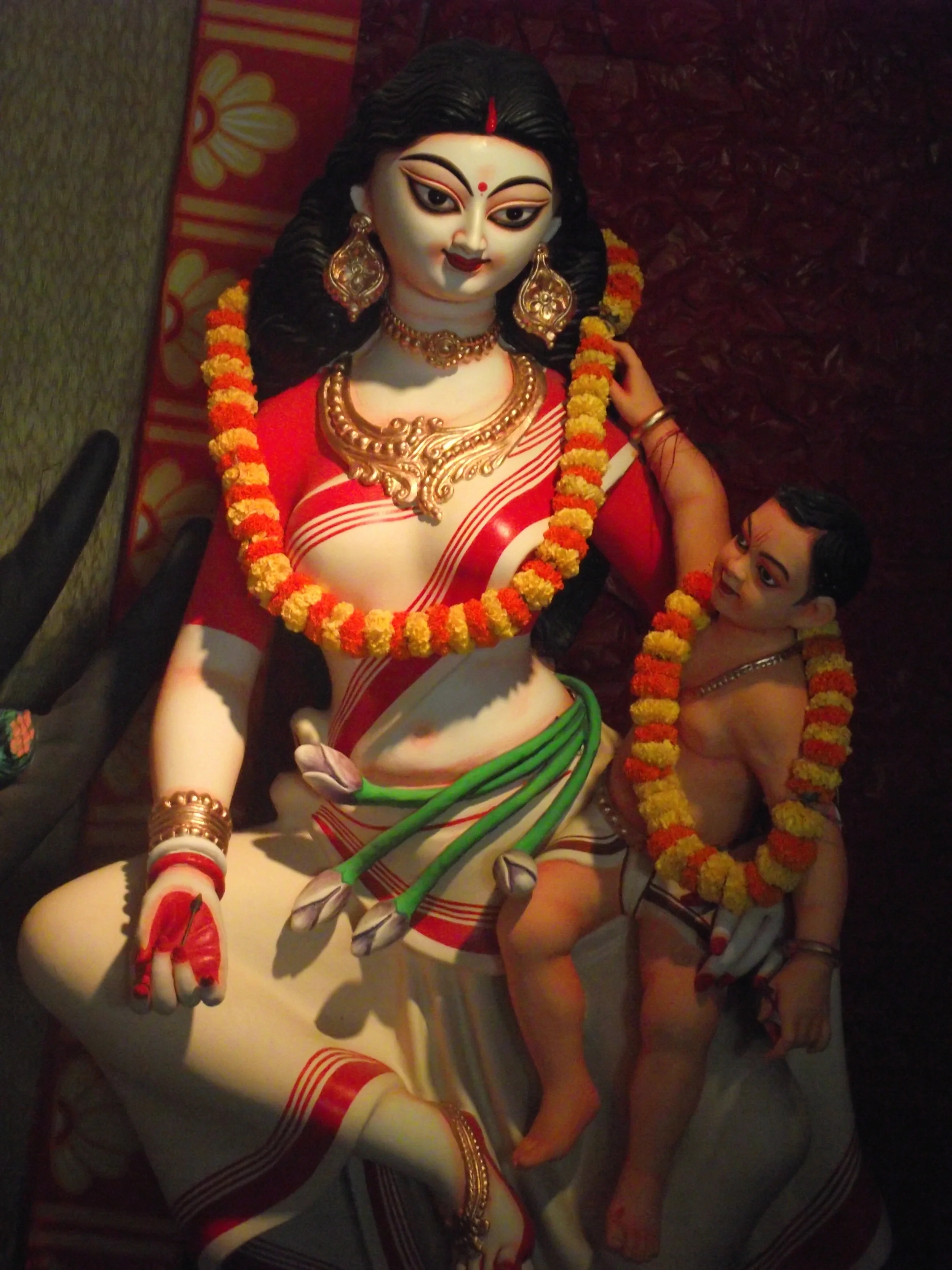 ...and Karthik in the lap of Saraswati 