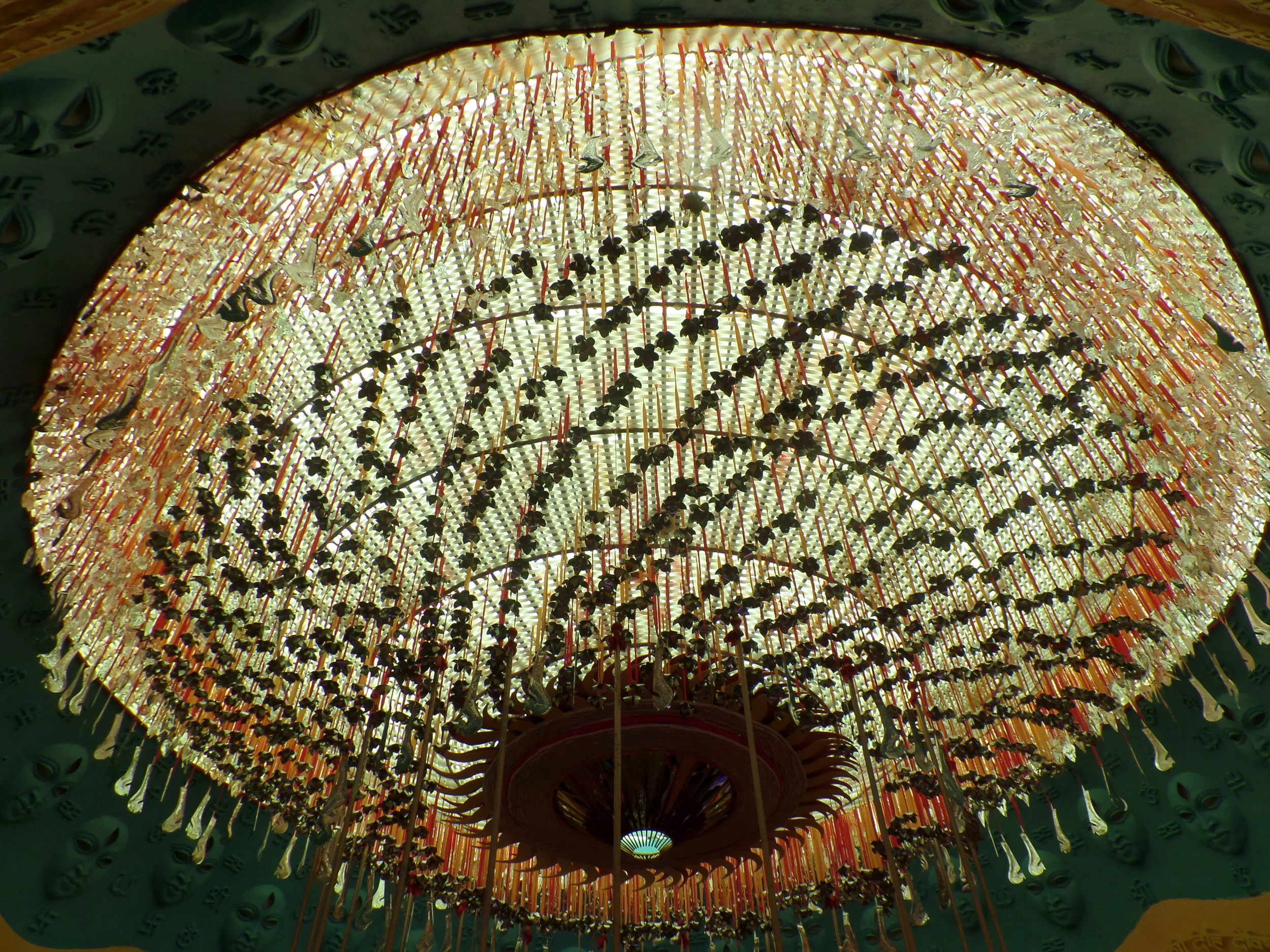  Ceiling of the pandal illuminated with the glazing trishul, chakras and kharas of devi Durga. 