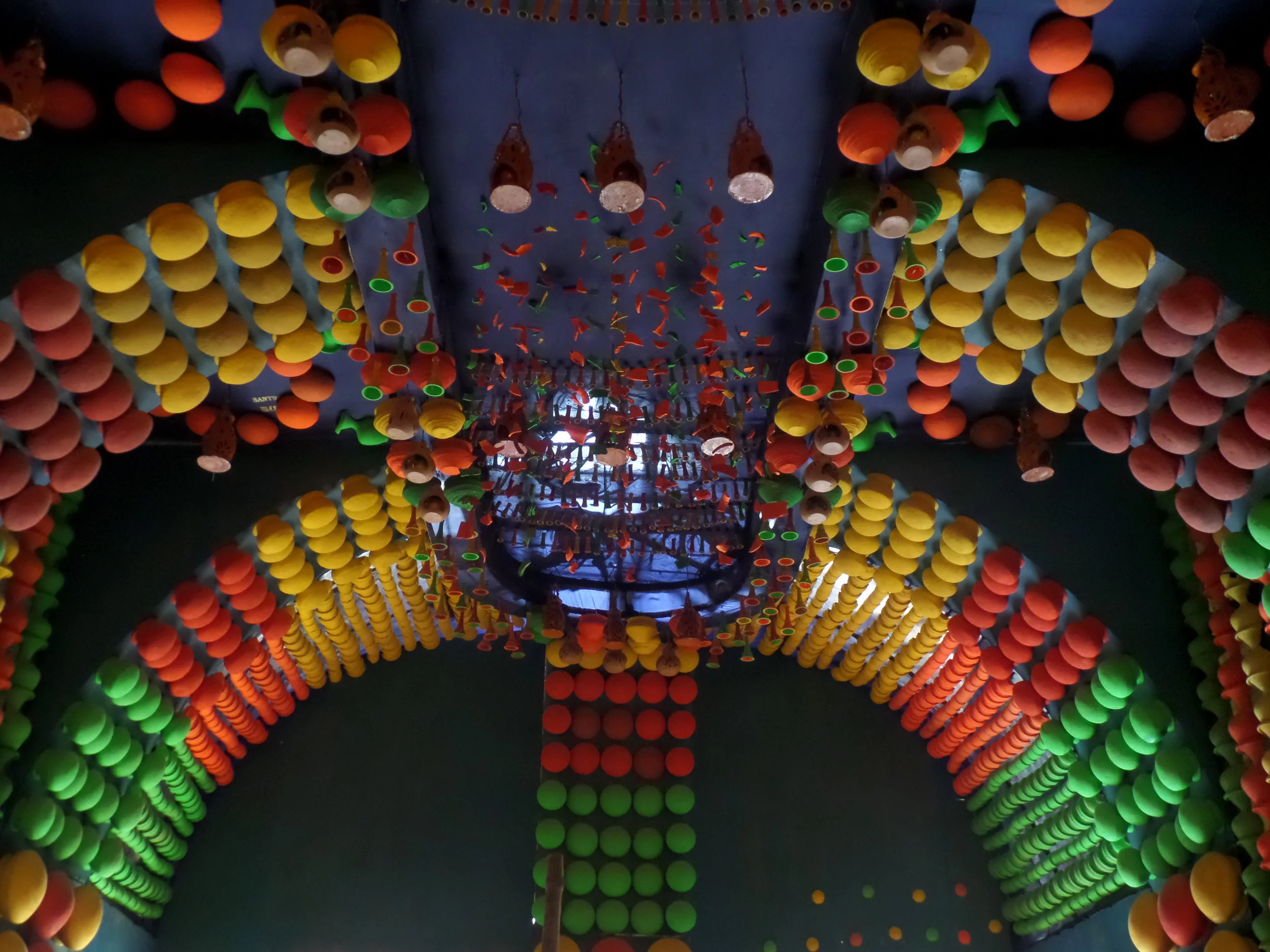  Colourful display in the ceiling created through different colours of pottery. 