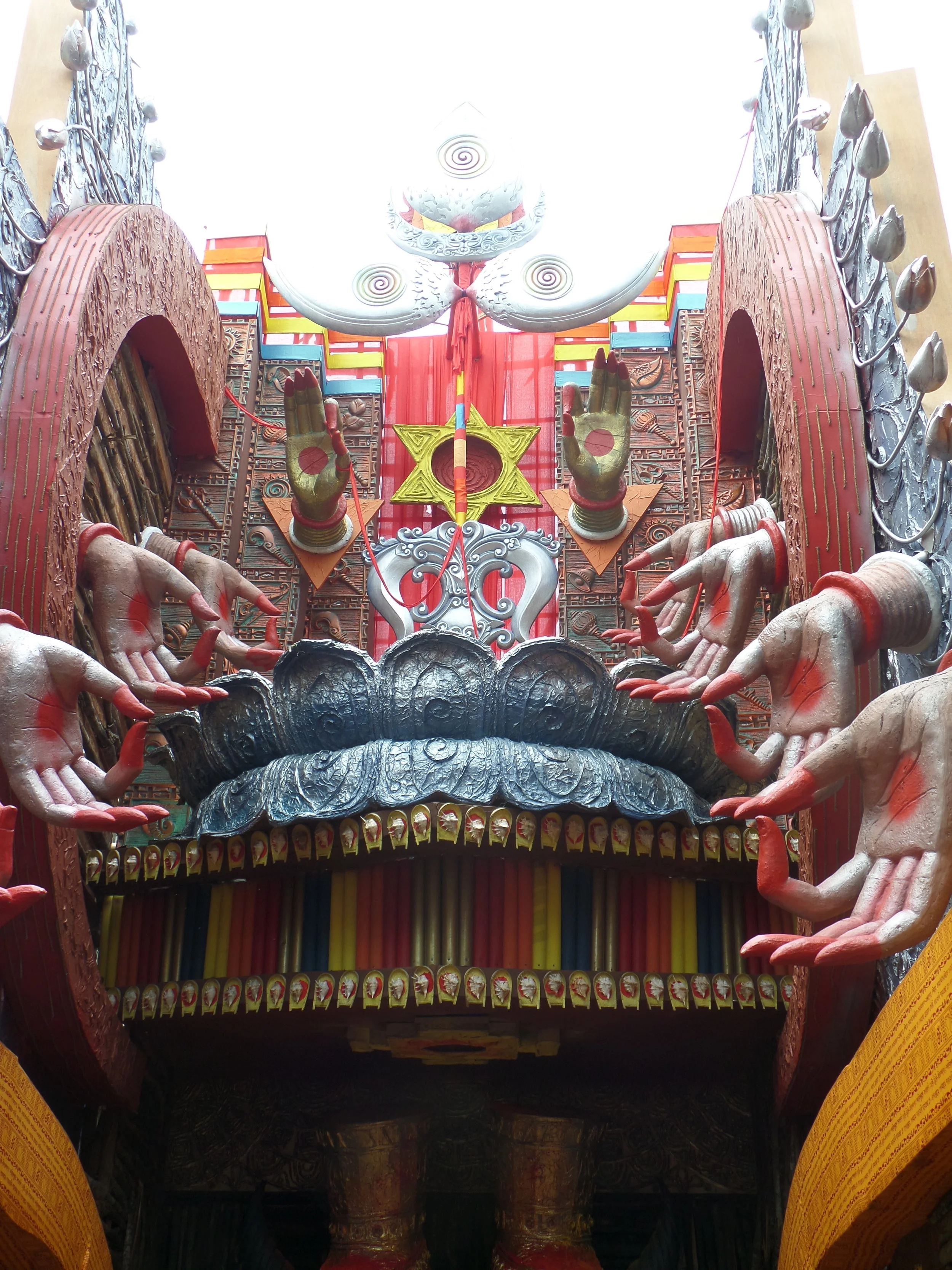  Speechless creativity, Observe the trinayan and the symbolic depiction of ten hands of Durga. 