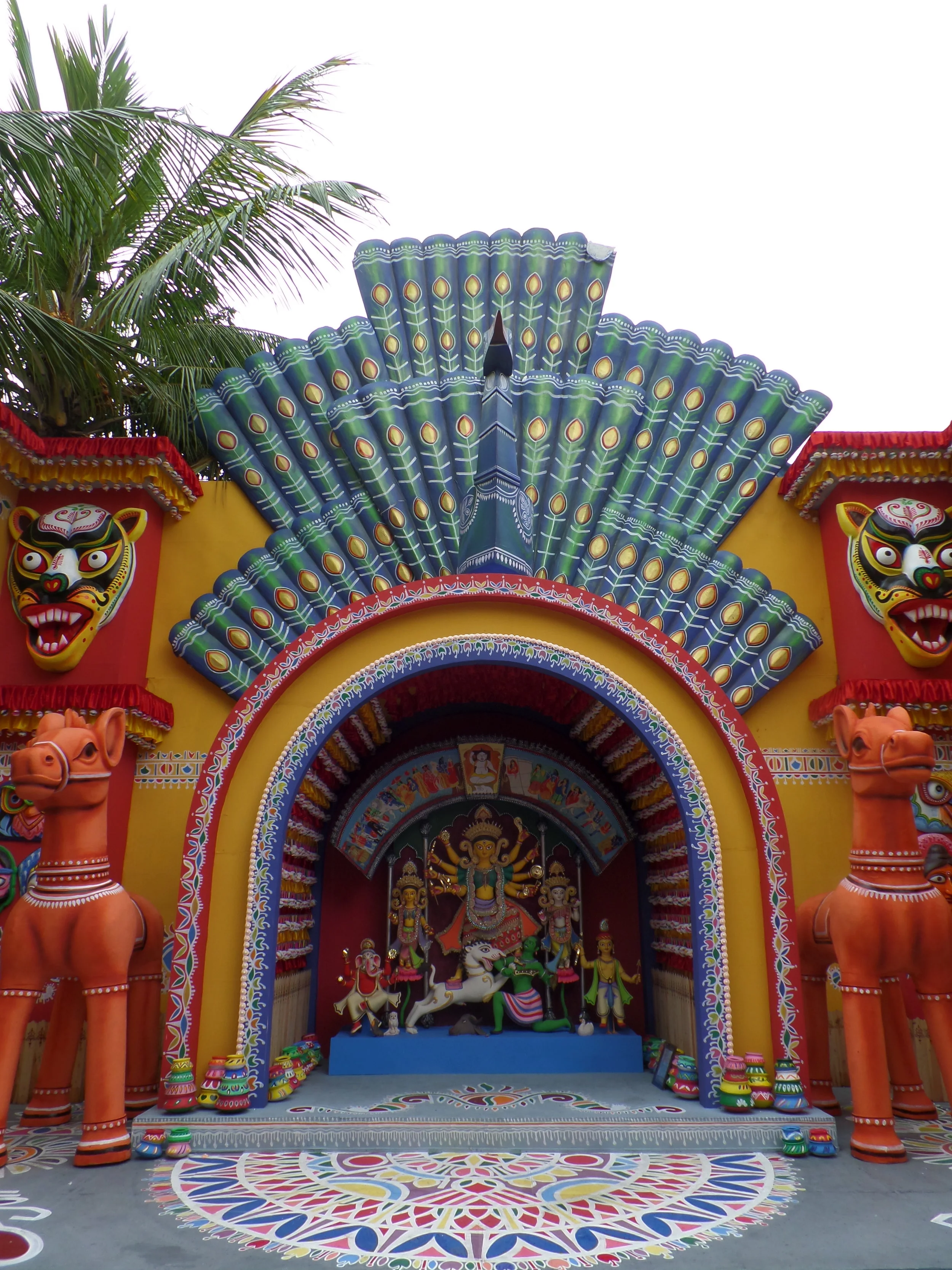  Every element of the pandal reflected the Bangladeshi artist's creations of colourful masks, alpona (floral patterns). 