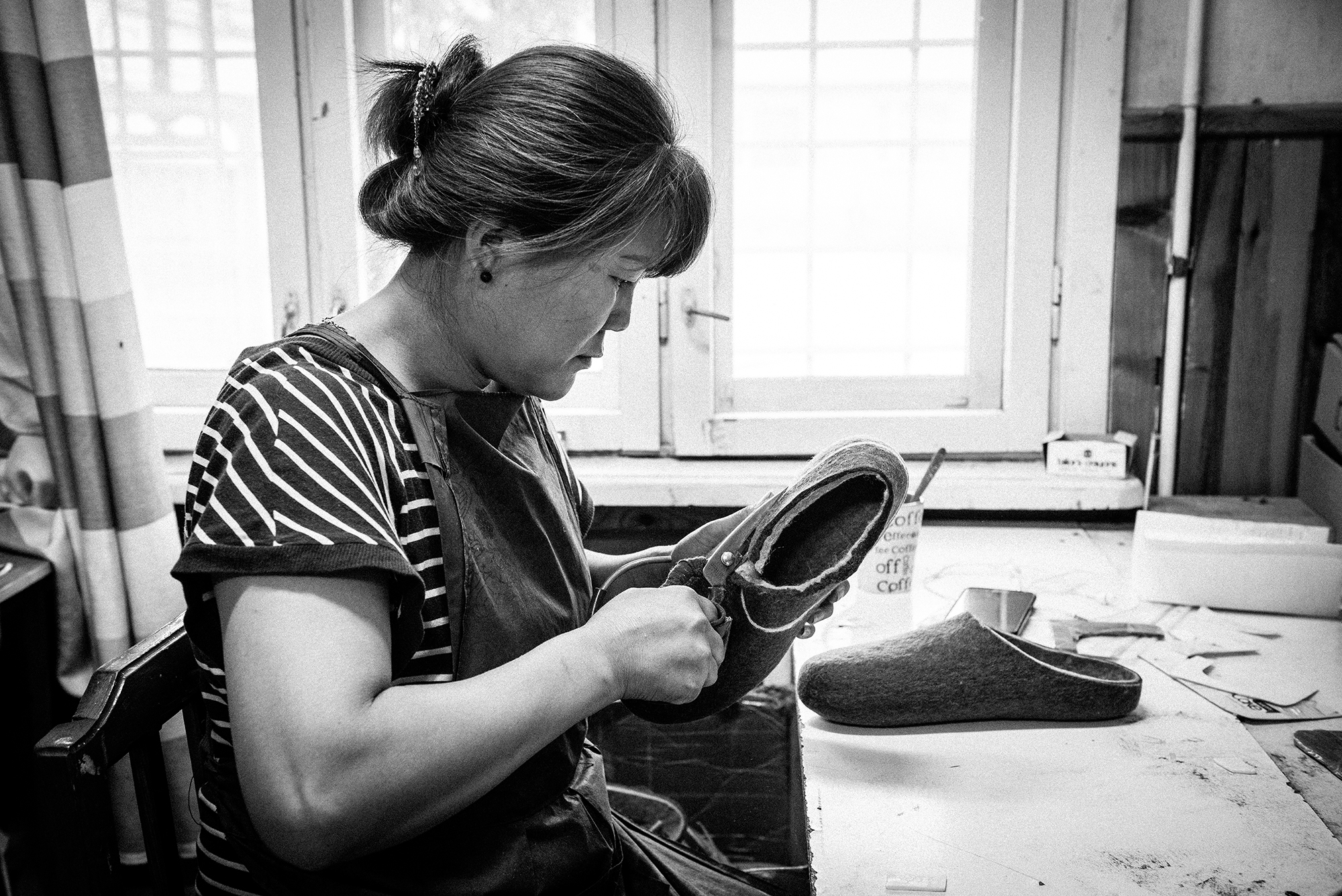 The final shape of the slipper is cut by hand at Tova.