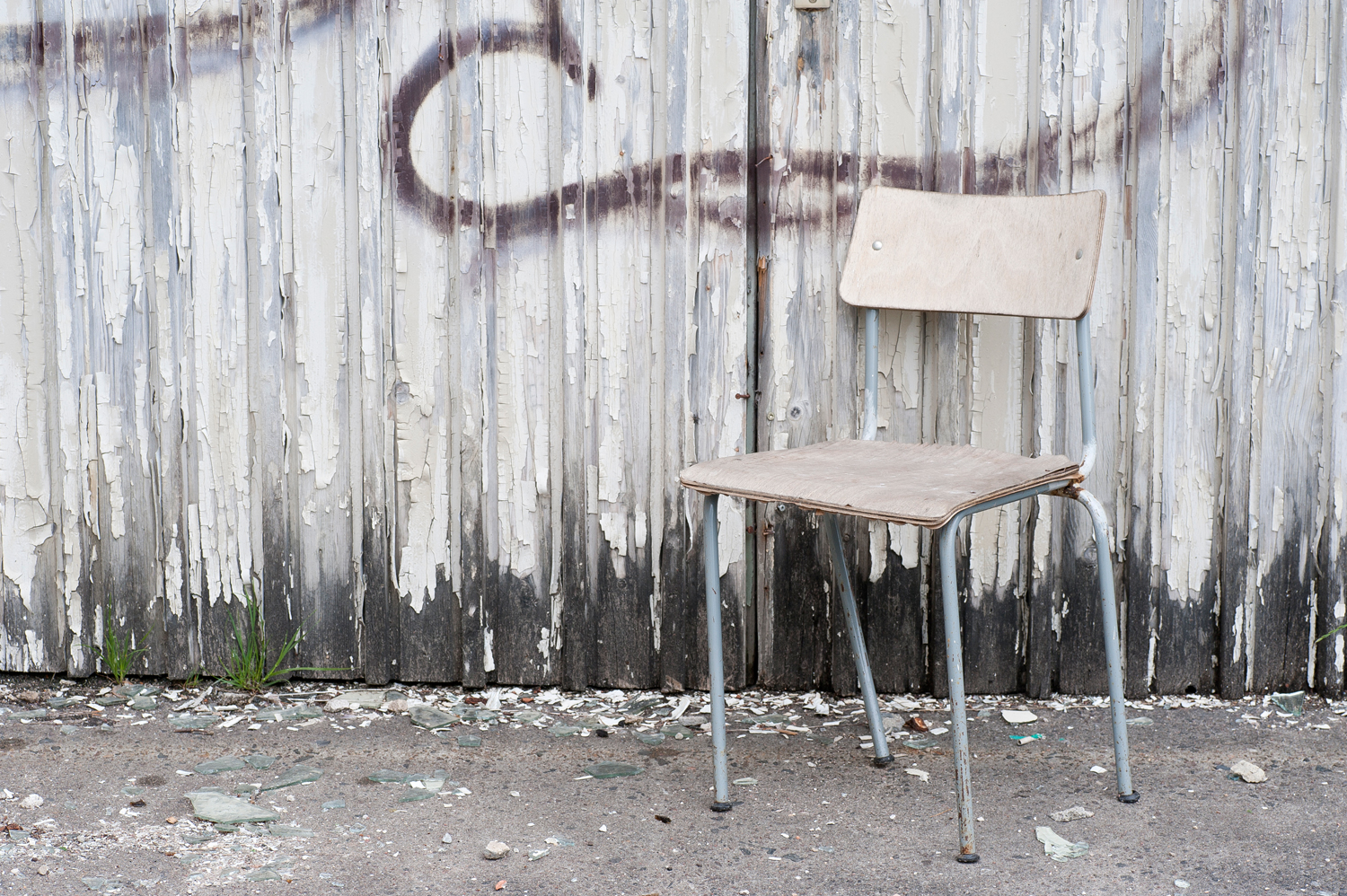 A wobbly chair in front of the spooky Nazi holiday complex Prora on the German island of Rügen.