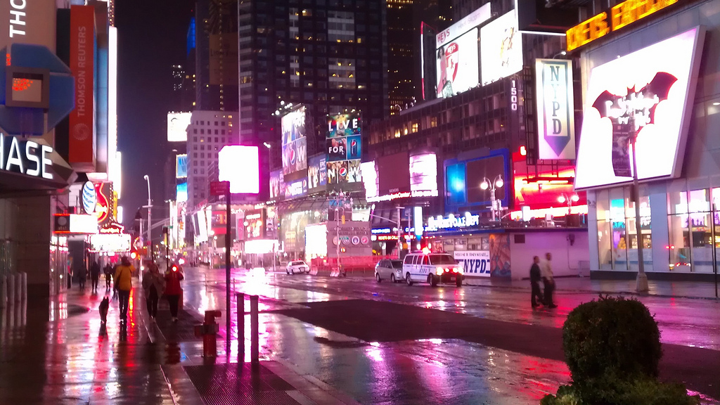 Times Square, rain-slick and empty, during Monday night's storm.