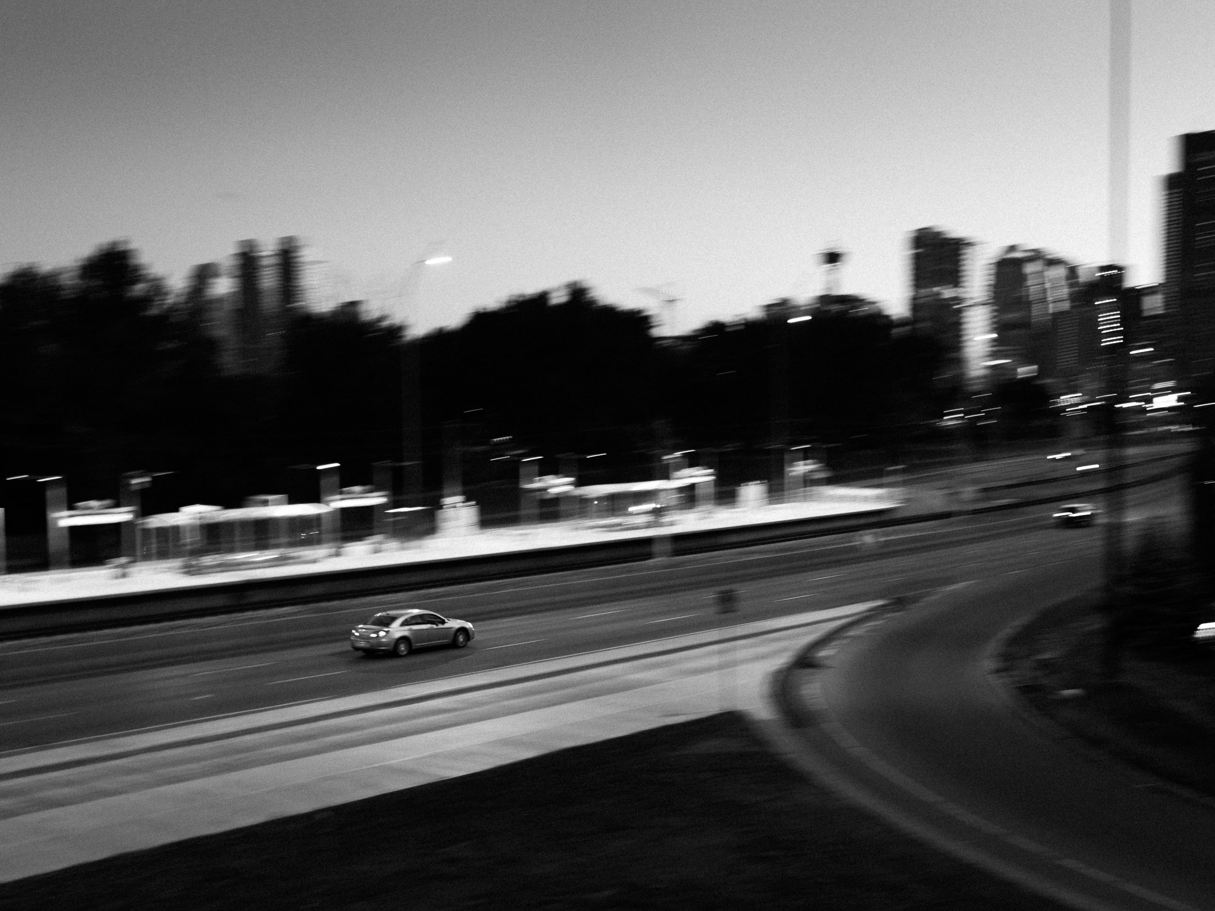  Part of the goal of these blog posts is about finding ways to make photos that look unlike my other photos. Panning, motion blur, and black and white made that happen in this one.&nbsp; 