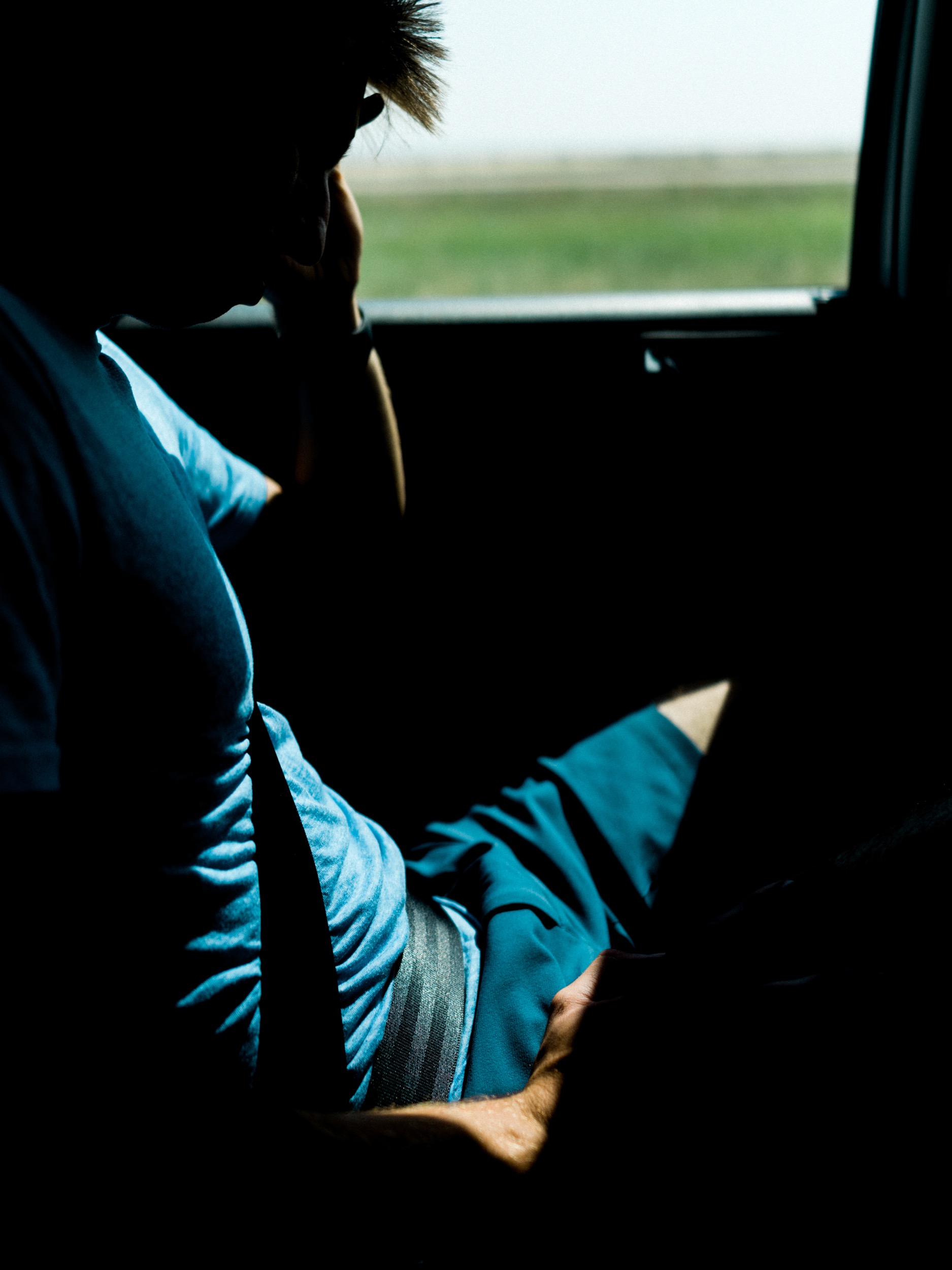  Levi always falls asleep on drives. The light coming in through the window created strong geometric shapes and I tried to emphasize them by underexposing the interior of the car.&nbsp; 