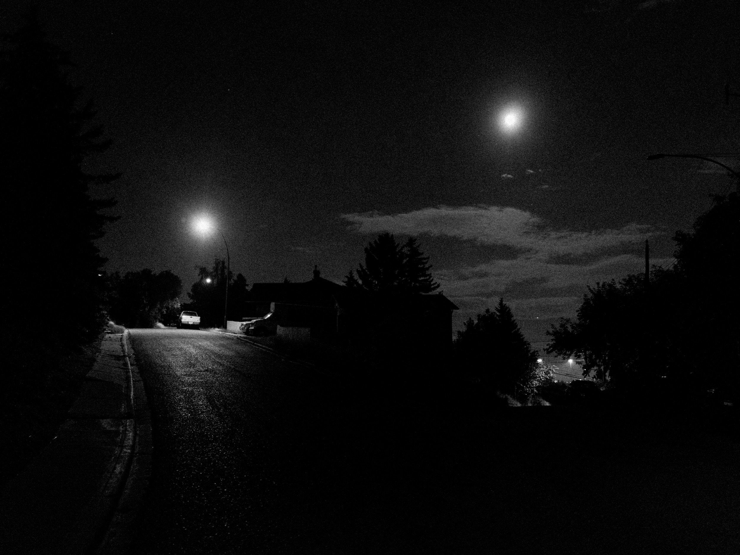  I love how the repetition turned out in this one. The road branches, and on one side is the streetlight and on the other side is the the moon. I recognize the luck in this photo. The moon isn't always in this position and it's an essential part of t