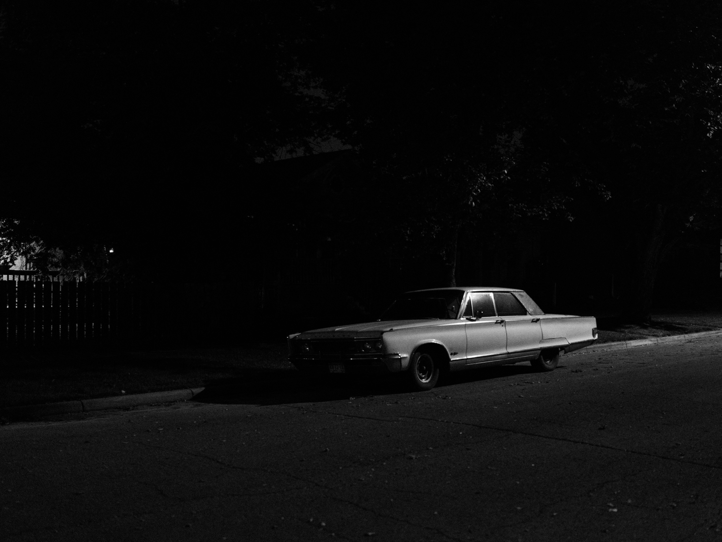 This photo walk happened late at night with strong winds. I could feel the anxiety that Robert Adams described. At any moment, a sound in the distance can conjure a feeling of dread, but it's all part of the excitement. And I found a classic car—it couldn't get better. 