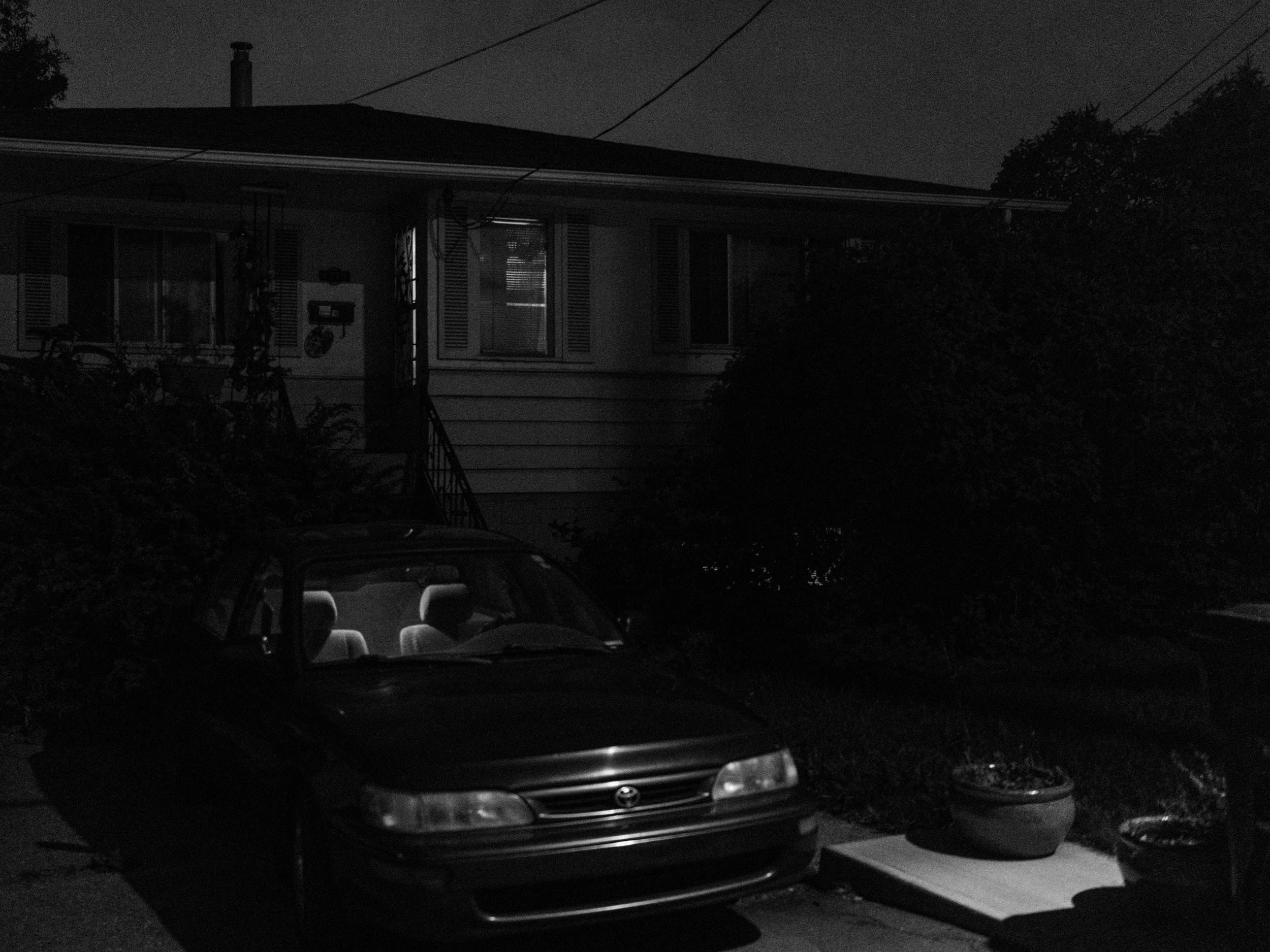There was a better photo here but I missed the opportunity. I walked by and noticed the door of the car and screen door of the home open. The whole scene was dramatic. I was about to lift the camera to my eye but I noticed someone rustling around in the back seat of the car. I already feel like a creep walking around taking photos at night, and capturing someone in this vulnerable position made me feel bad. 