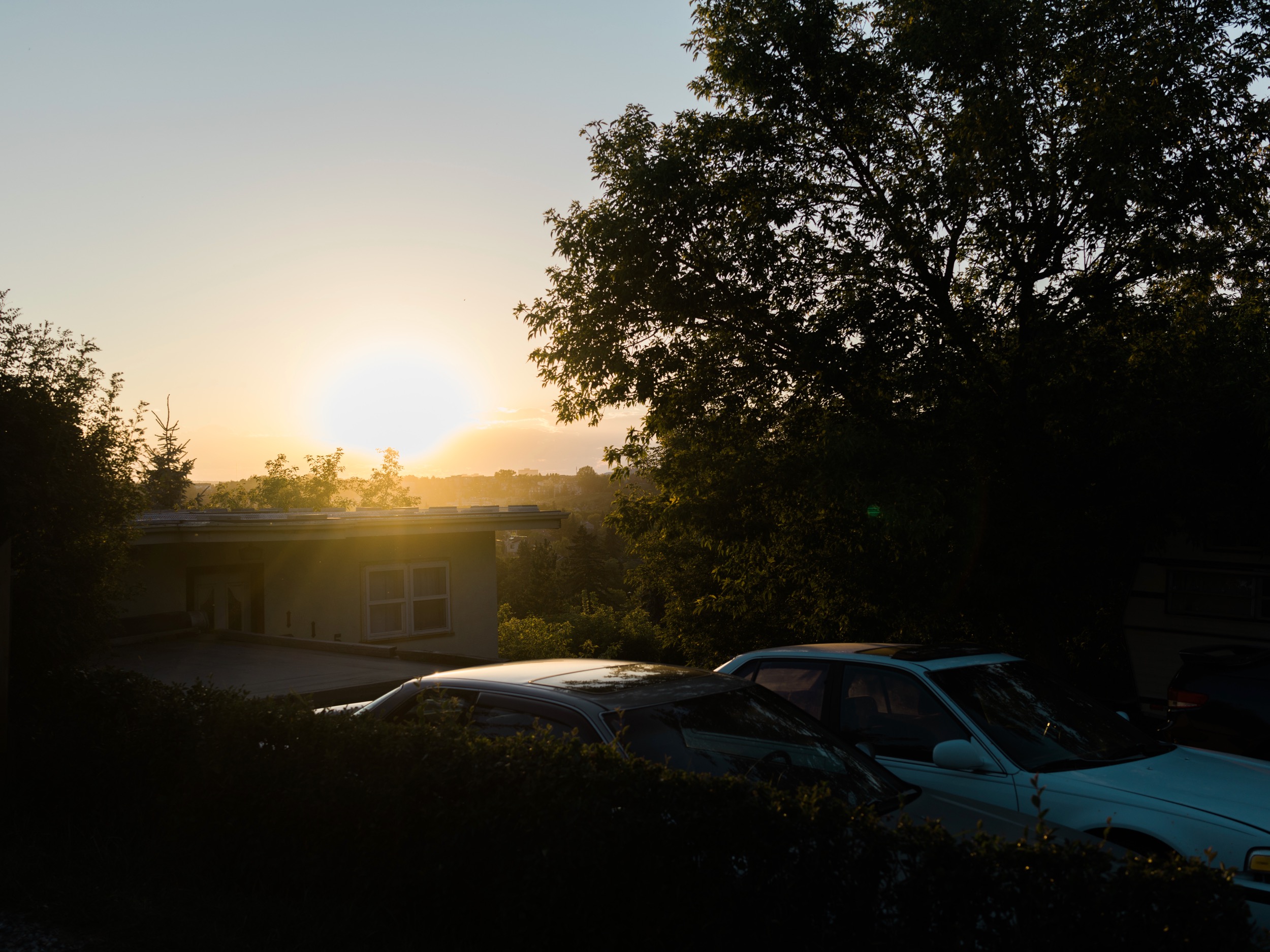 I'm exposing for the sky here which is making dark silhouettes in the foreground. I found the car roof worked in a similar way as exposing reflected light on water. 