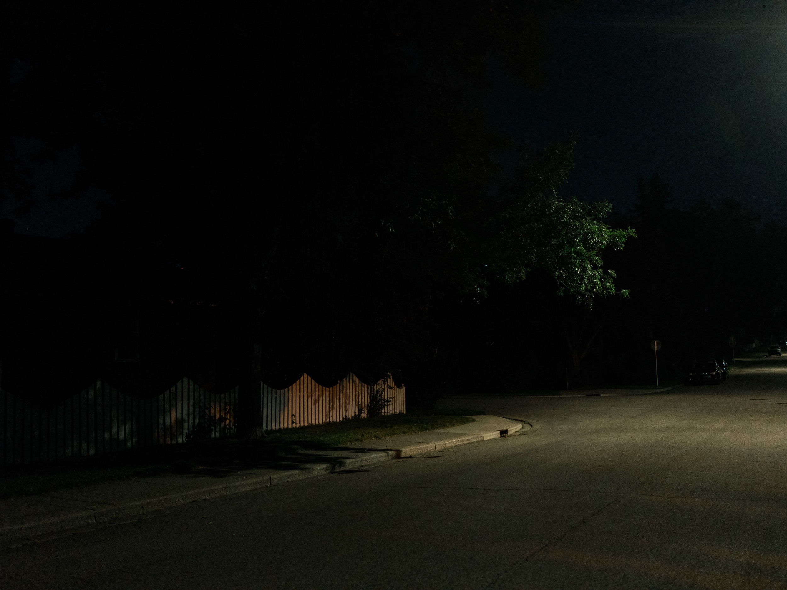  A quiet street corner at night. I love how the elements in this picture peek out of the dominantshadows.&nbsp; 