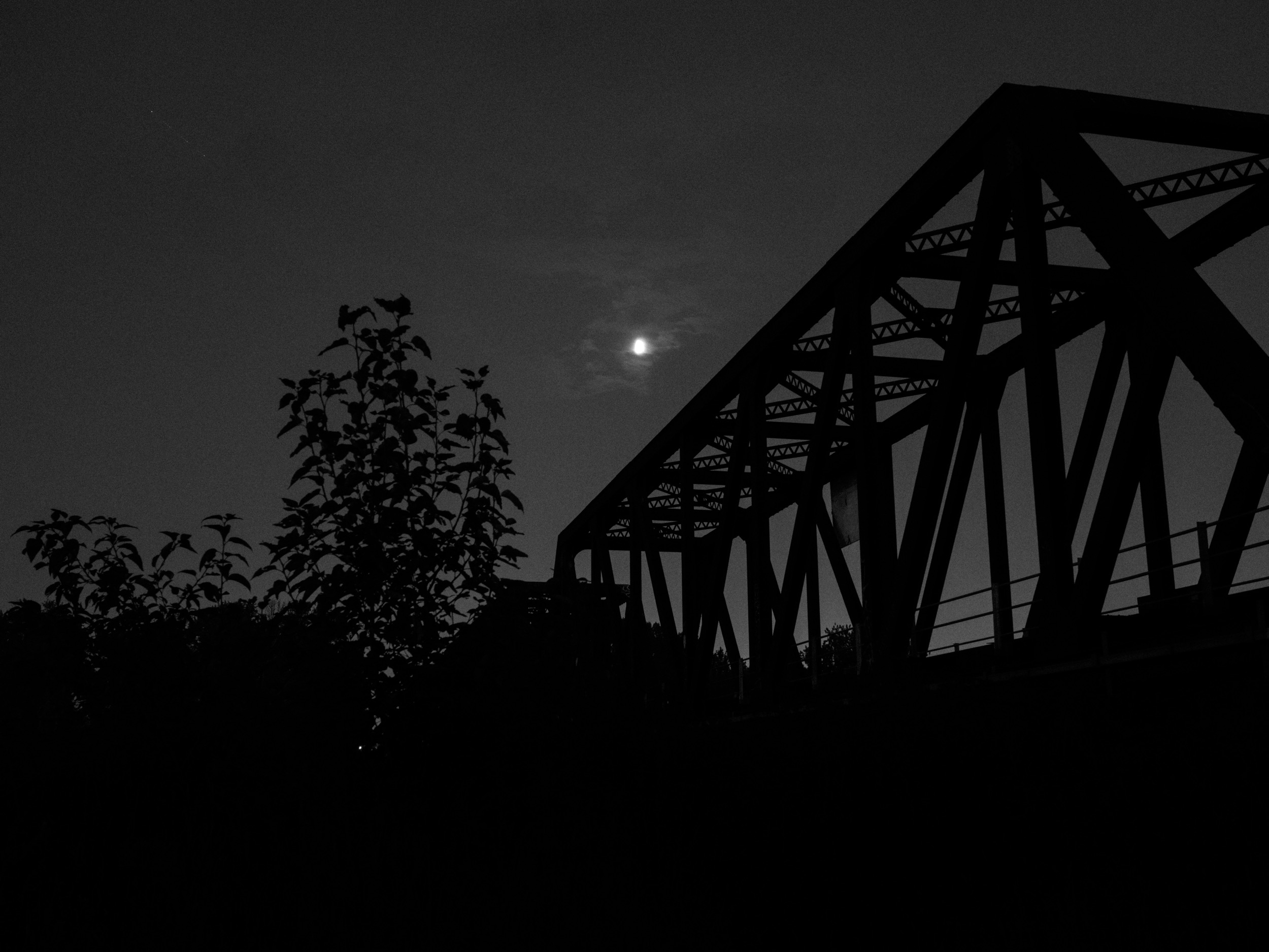 Bridge silhouette. Also using a tripod at night. 