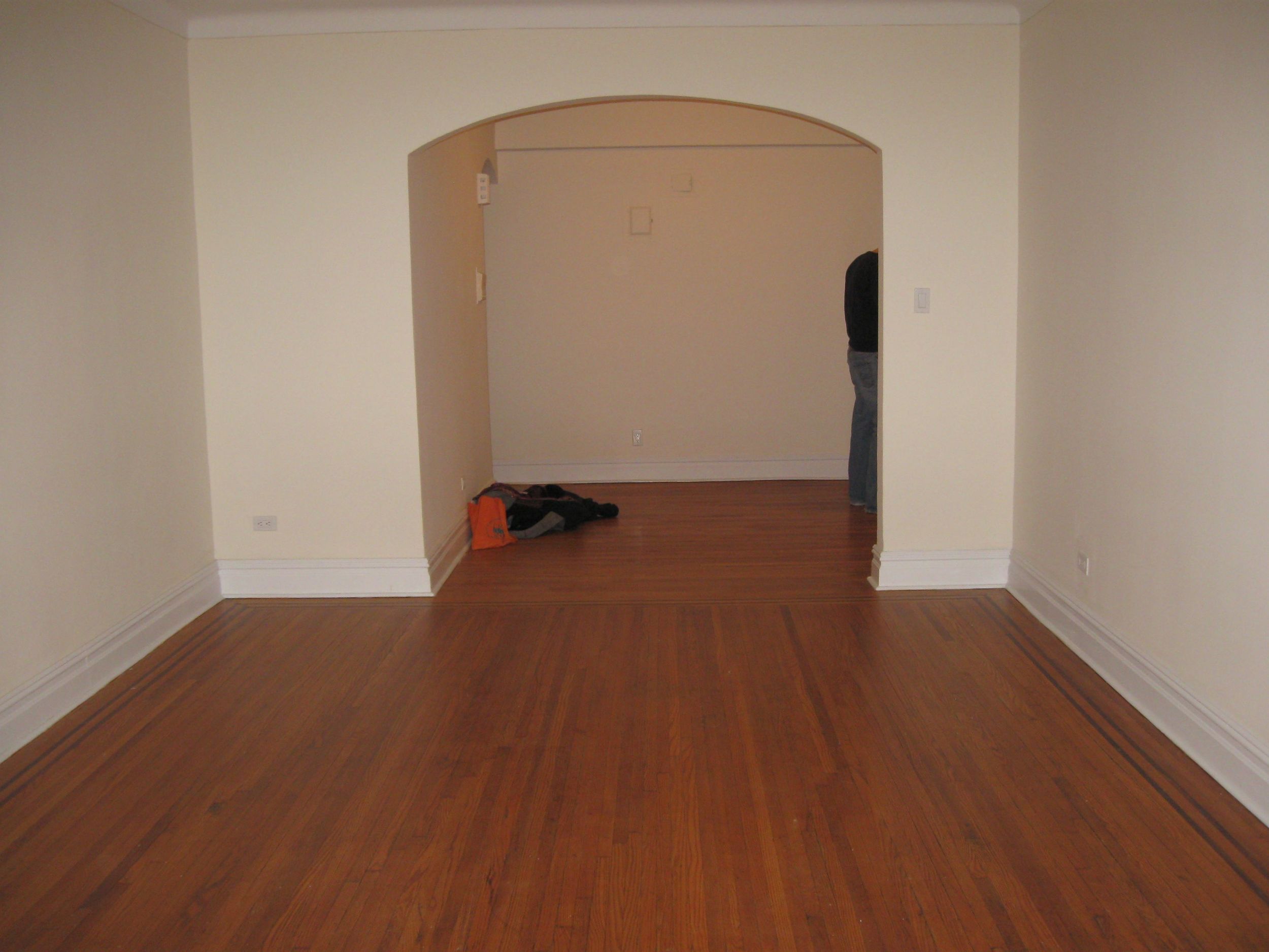 Living room from far wall, looking at foyer.jpg