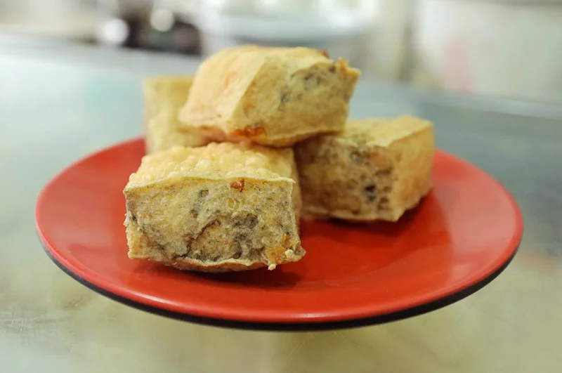 Stinky Tofu -- a fermented tofu that is a popular street food in China. You can smell the pungent aromas from a mile away. 