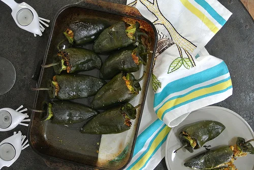 oaxacan cornbread-stuffed roasted poblanos table.jpg