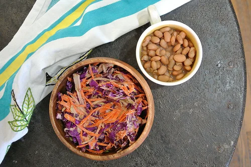 smoky pinto beans + red cabbage-carrot-pear slaw with creamy mustard-orange-walnut dressing table.jpg