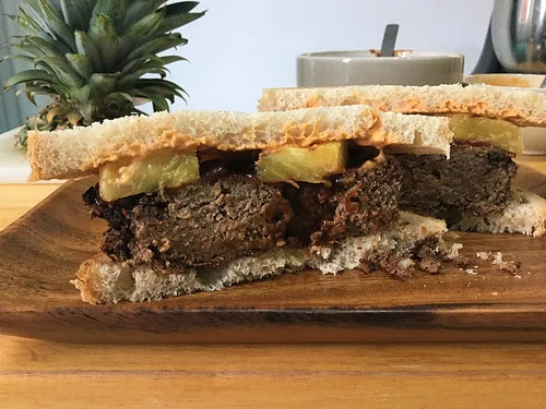 bbq tofu-pecan loaf sandwich with pineapple and smoky tahini sauce cross section.jpg