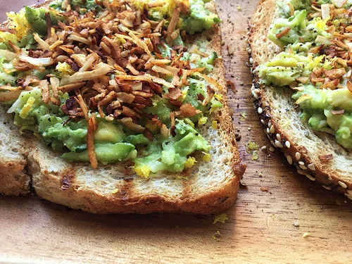 dead simple zucchini toast with avocado, lemin zest, and coconut bacon detail.jpg